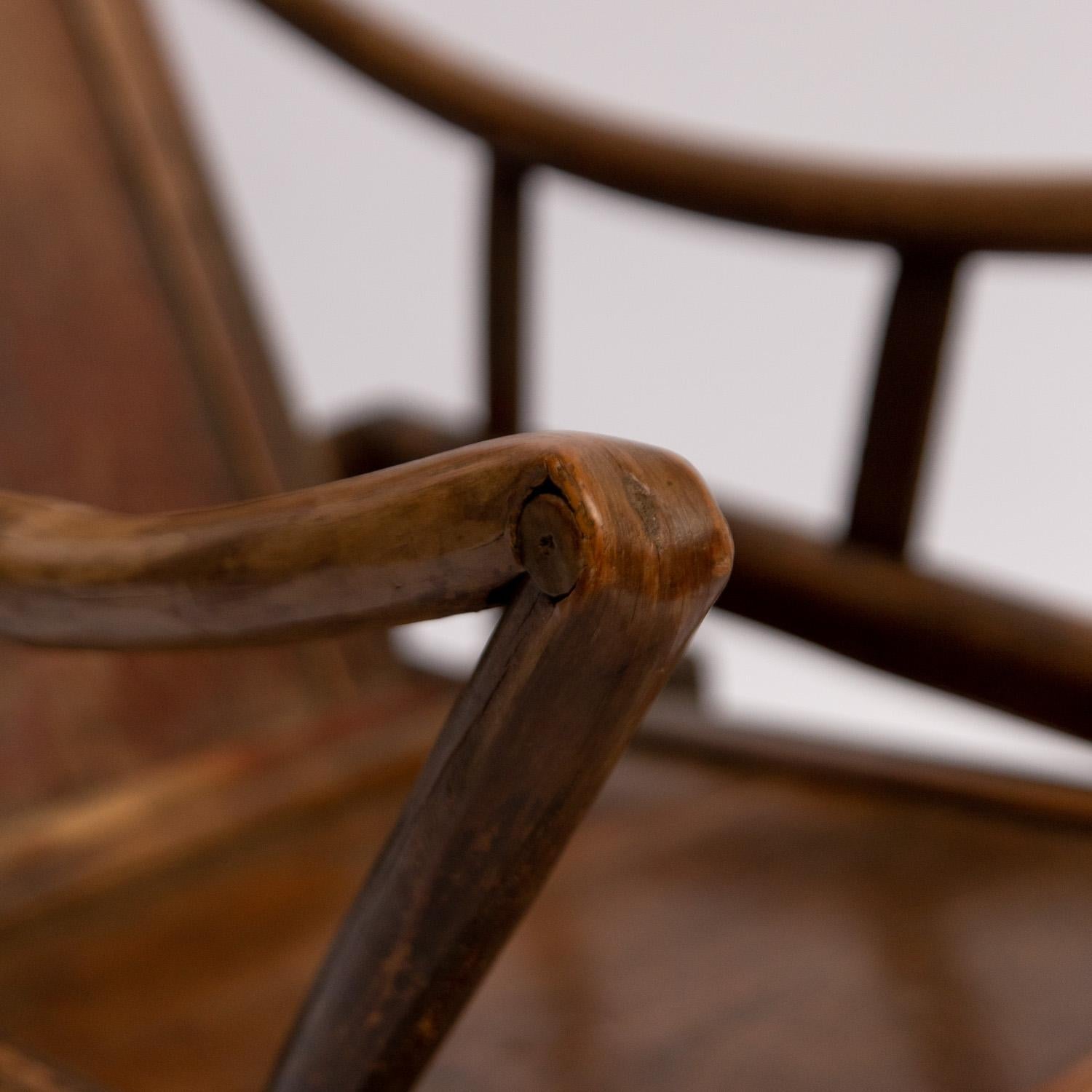 Original antique Chinese 19th century handcrafted adjustable yoke back wooden reclining lounge chair, 1800-1850. Adjustable backrest and uniquely curved armrests. Good color and patina. Adjustable Yoke backrest is complimented by the beautiful