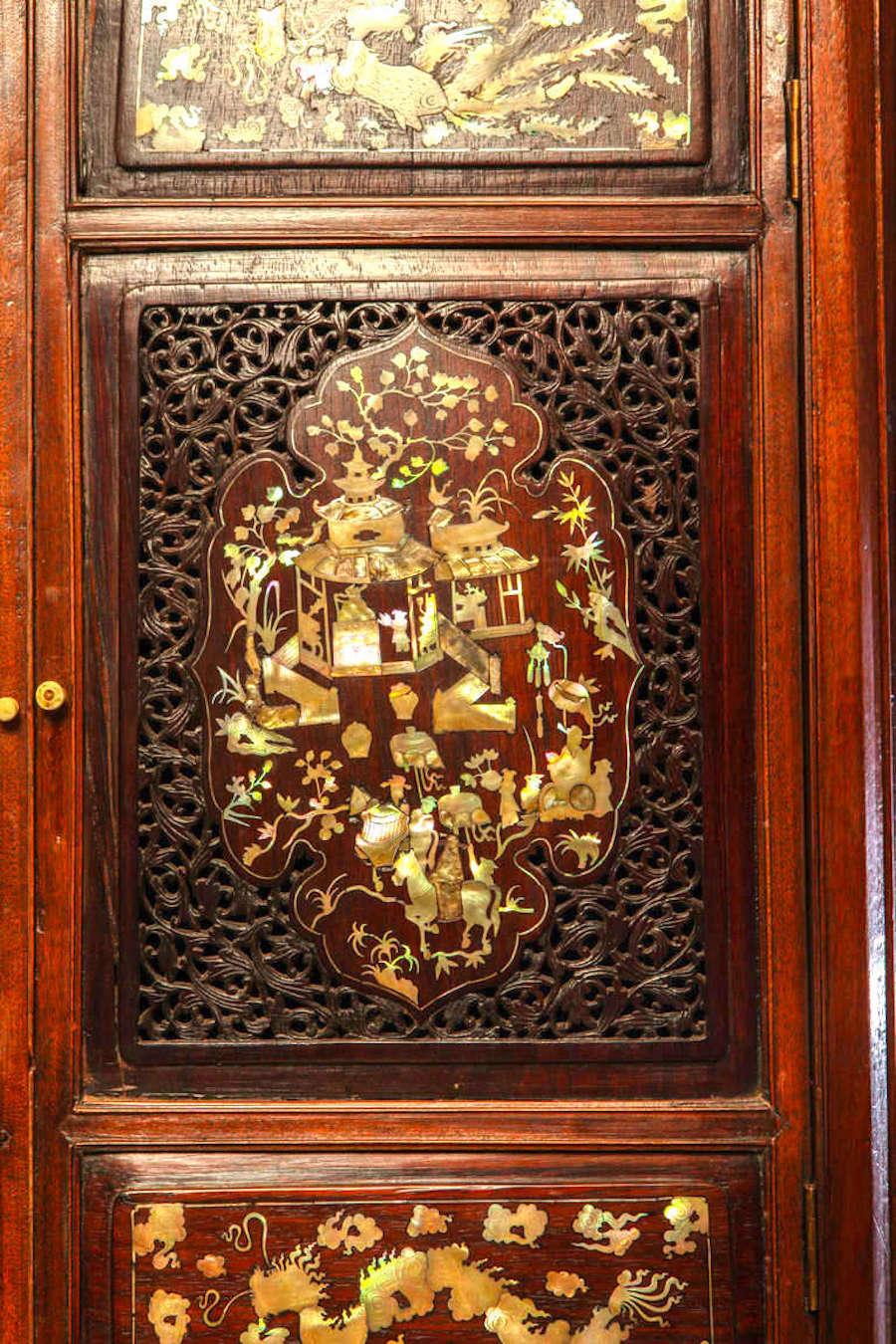 A stunning Chinese highly carved hardwood cabinet with mother of pearl engraved design.
Qing dynasty, 19th century.
Dimension: 200 cm x 120 cm x 58 cm.