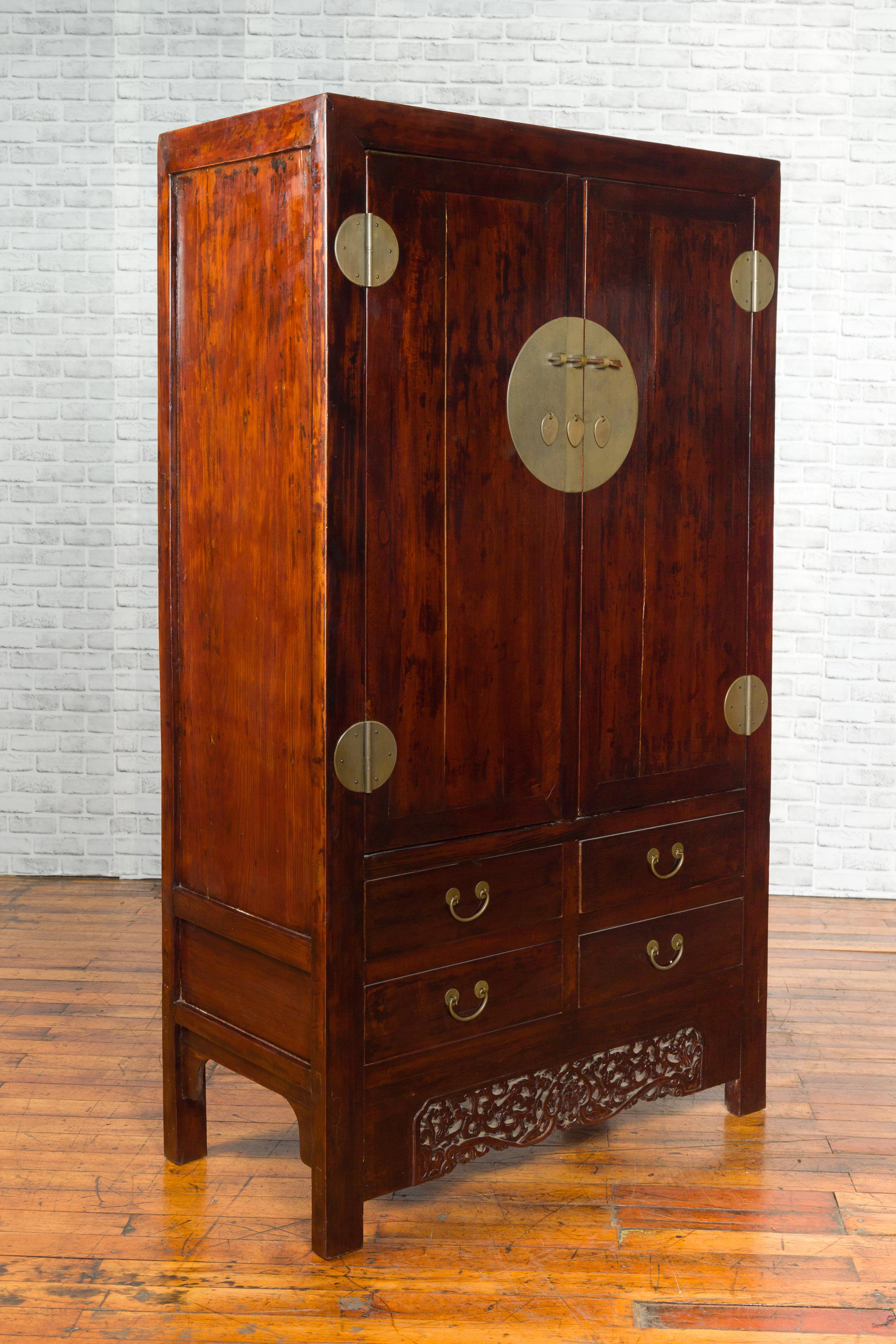 Chinese 19th Century Qing Dynasty Brown Lacquered Cabinet with Carved Apron In Good Condition For Sale In Yonkers, NY