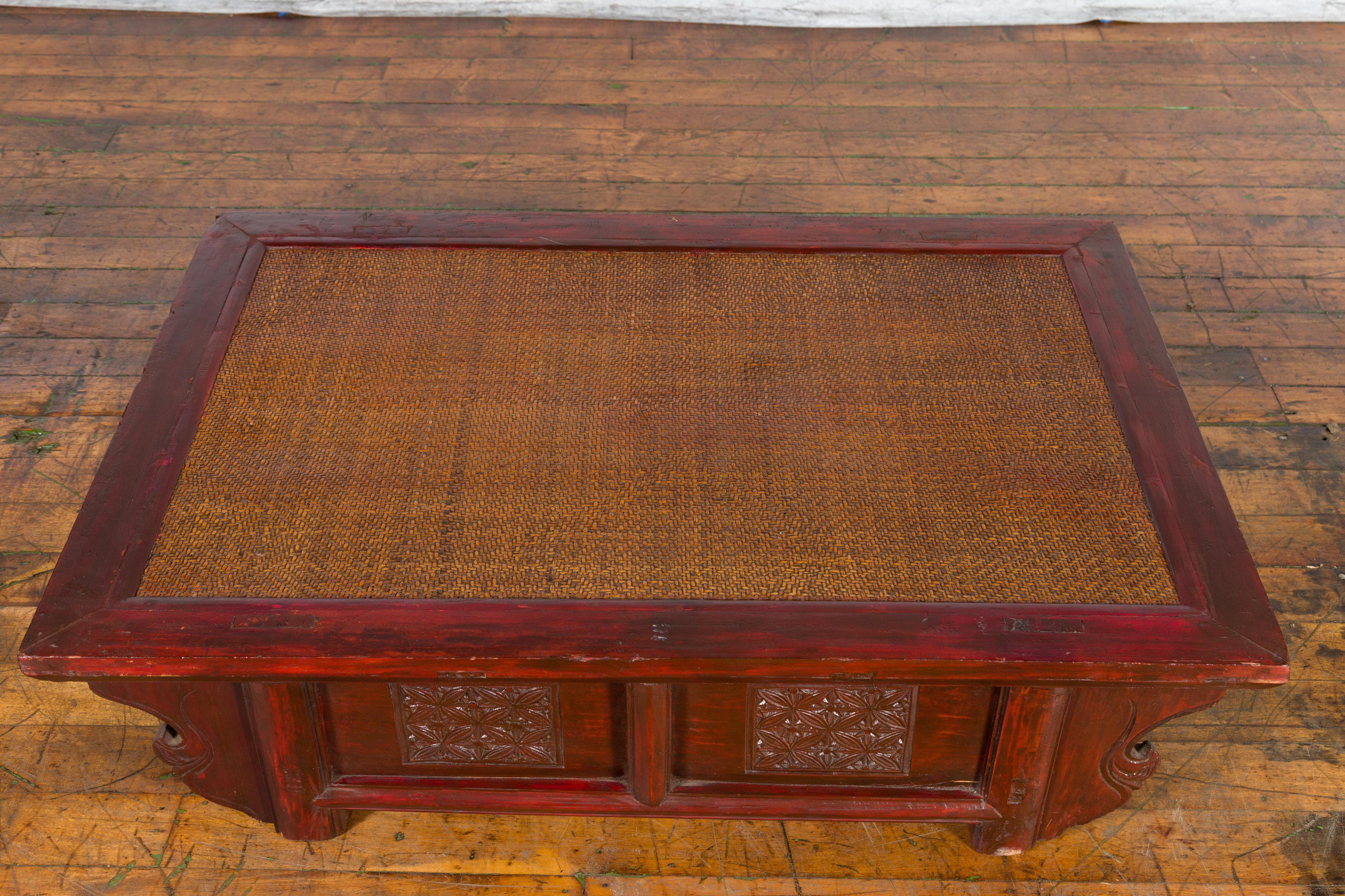Carved Chinese 19th Century Qing Dynasty Dark Red Lacquer Coffee Table with Rattan Top For Sale