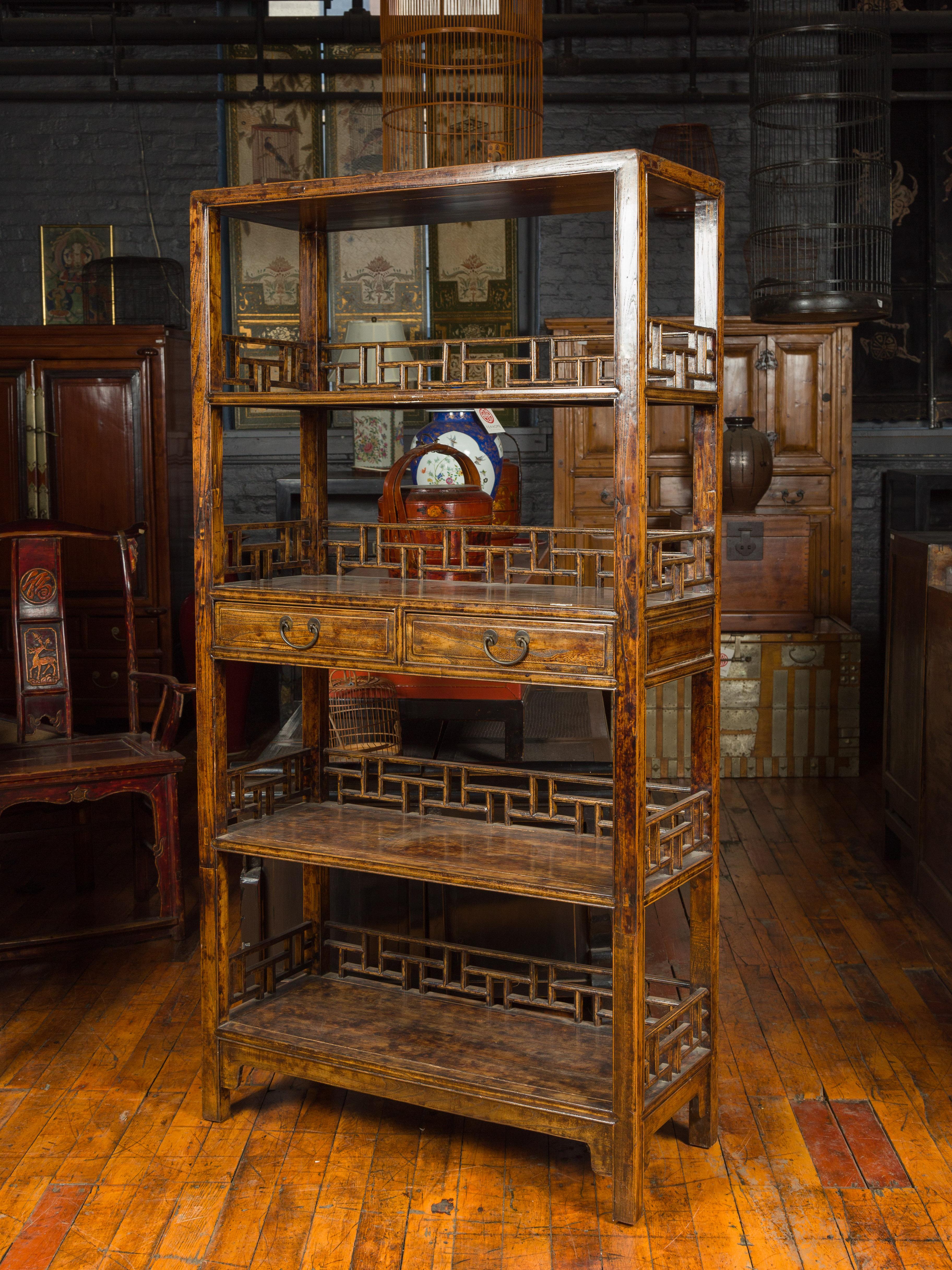 Chinese 19th Century Qing Dynasty Elm Bookcase with Fretwork Sides and Drawers 7