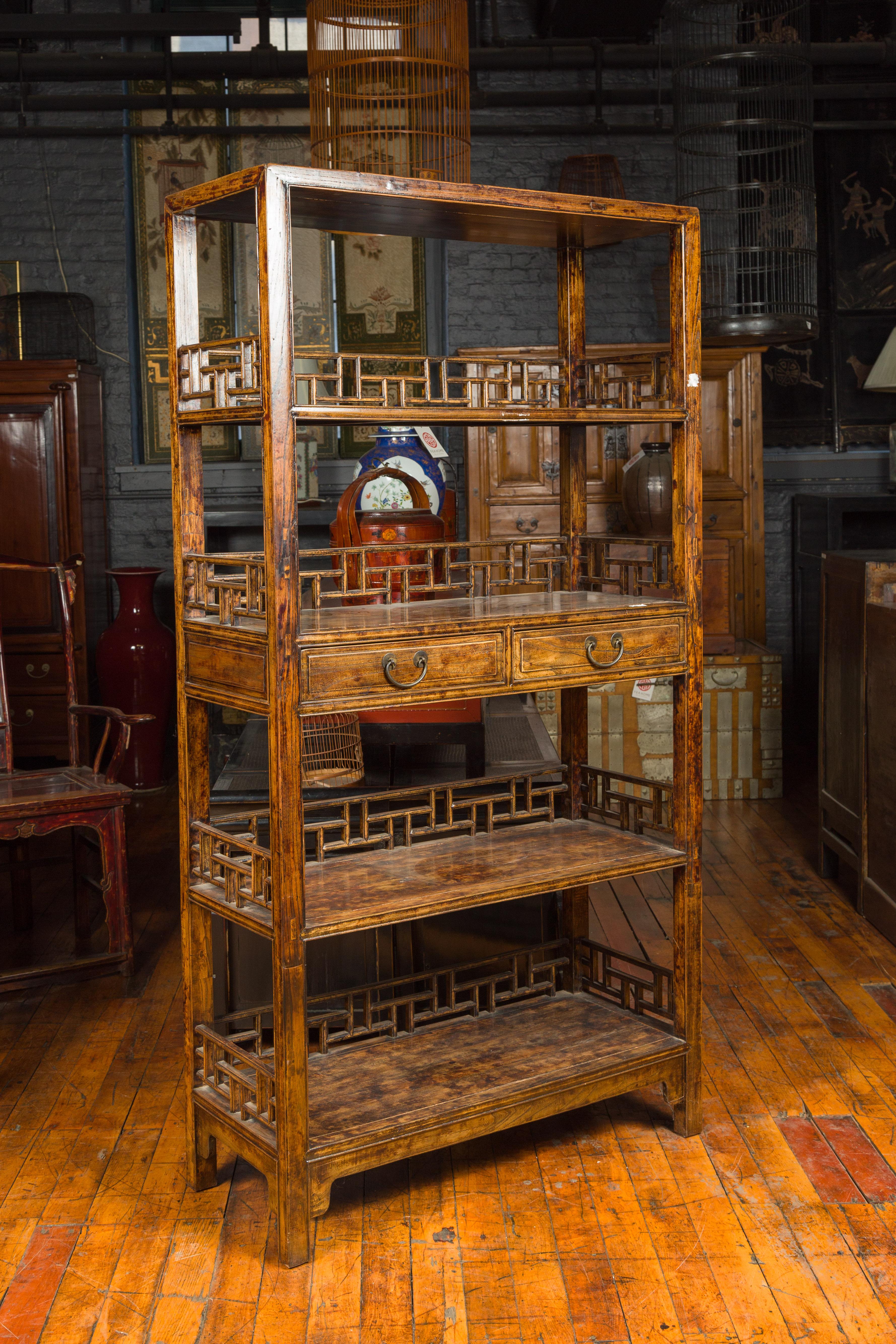 Stained Chinese 19th Century Qing Dynasty Elm Bookcase with Fretwork Sides and Drawers