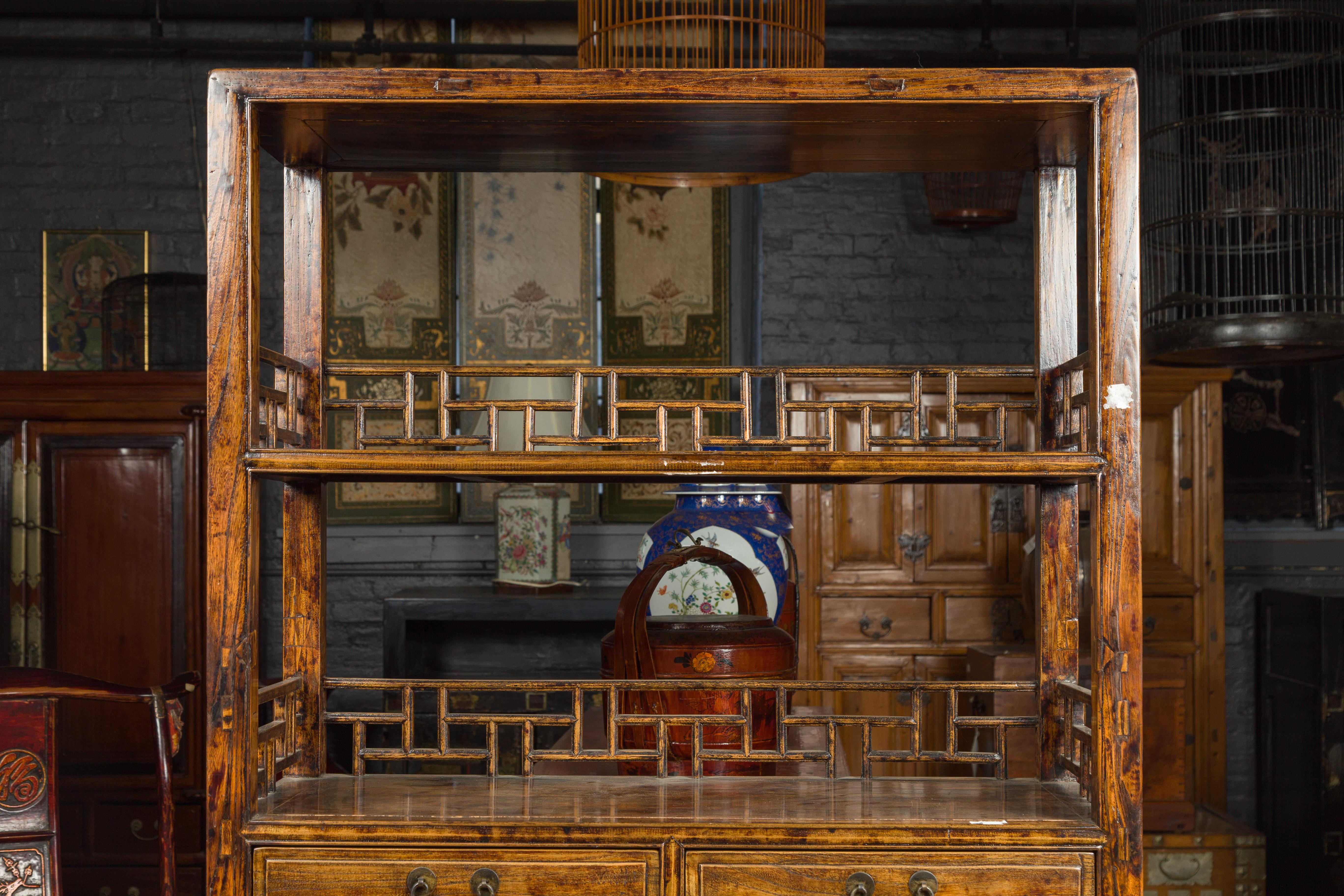 Chinese 19th Century Qing Dynasty Elm Bookcase with Fretwork Sides and Drawers In Good Condition In Yonkers, NY