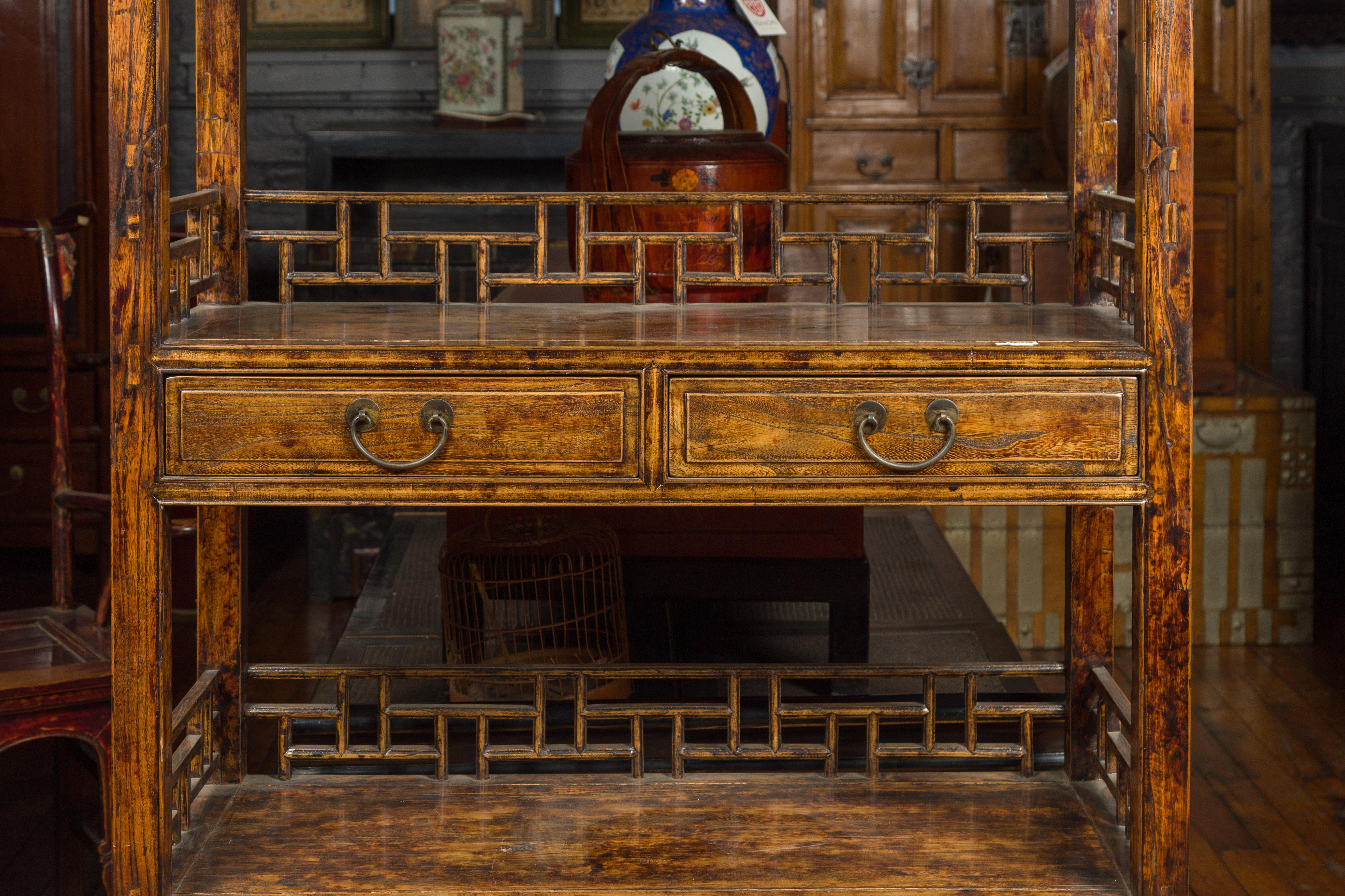 Chinese 19th Century Qing Dynasty Elm Bookcase with Fretwork Sides and Drawers 1