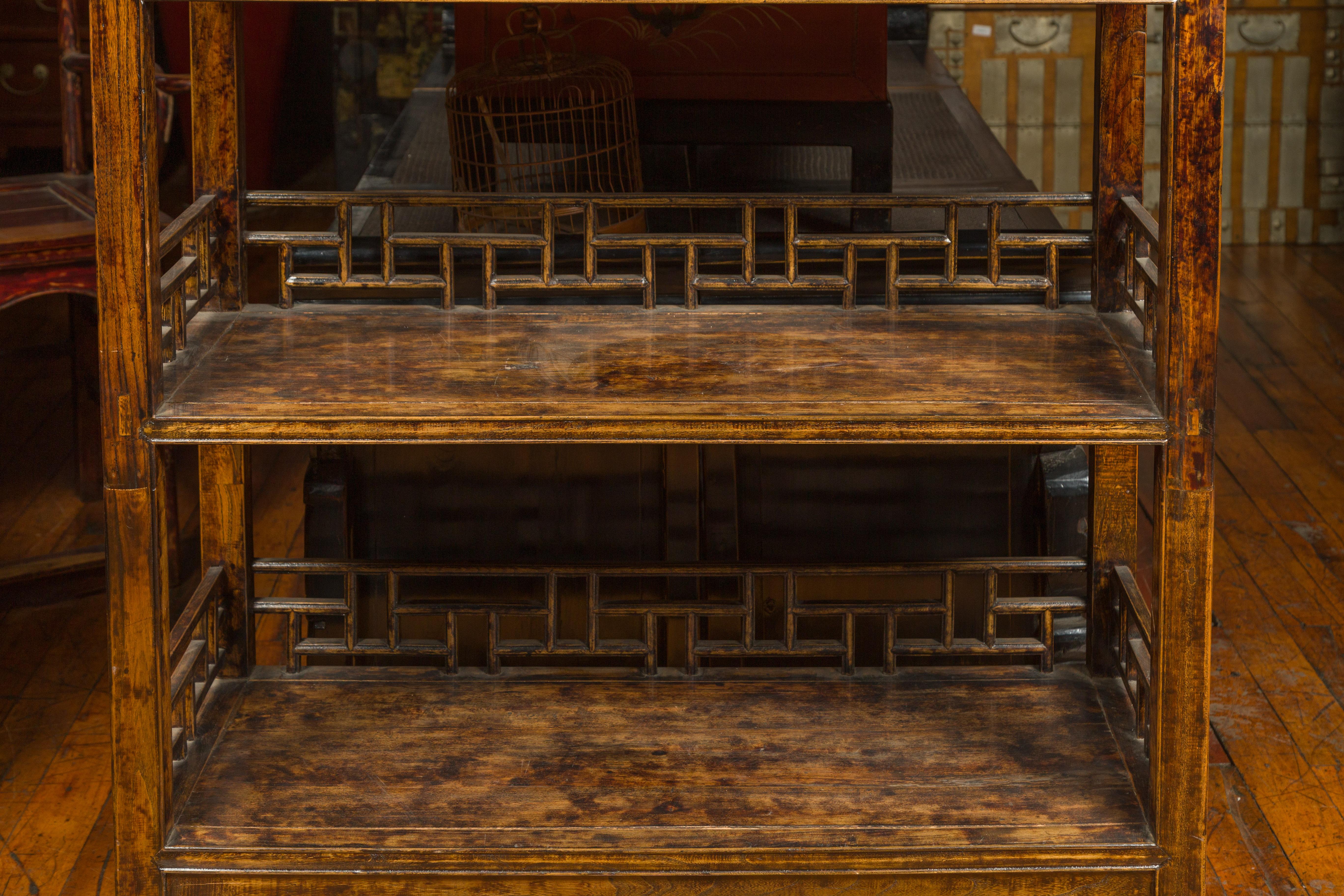 Chinese 19th Century Qing Dynasty Elm Bookcase with Fretwork Sides and Drawers 2