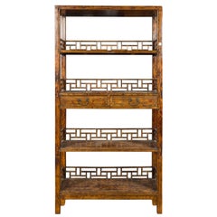 Antique Chinese 19th Century Qing Dynasty Elm Bookcase with Fretwork Sides and Drawers