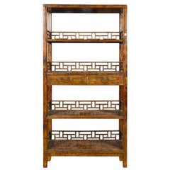 Chinese 19th Century Qing Dynasty Elm Bookcase with Fretwork Sides and Drawers