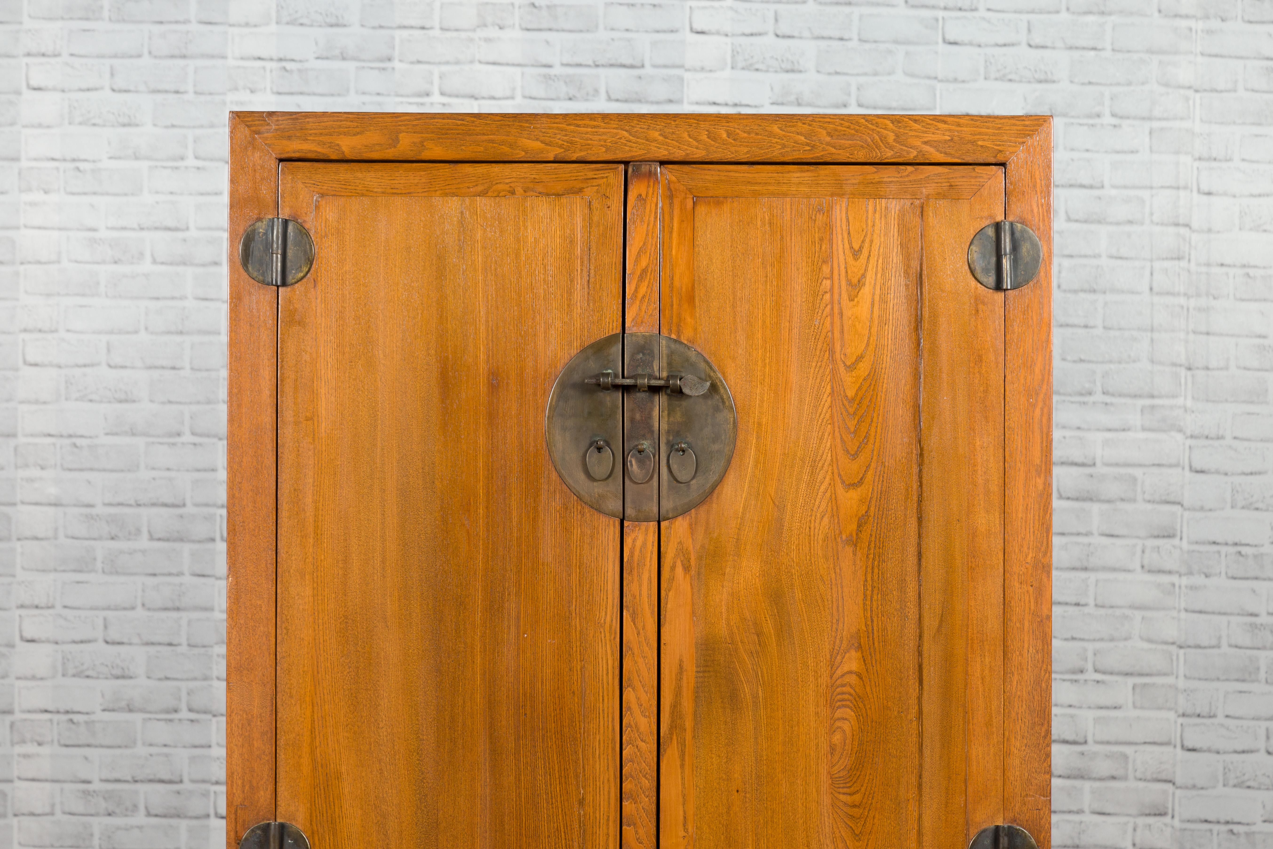 Brass Chinese 19th Century Qing Dynasty Period Natural Elm Cabinet with Carved Apron For Sale