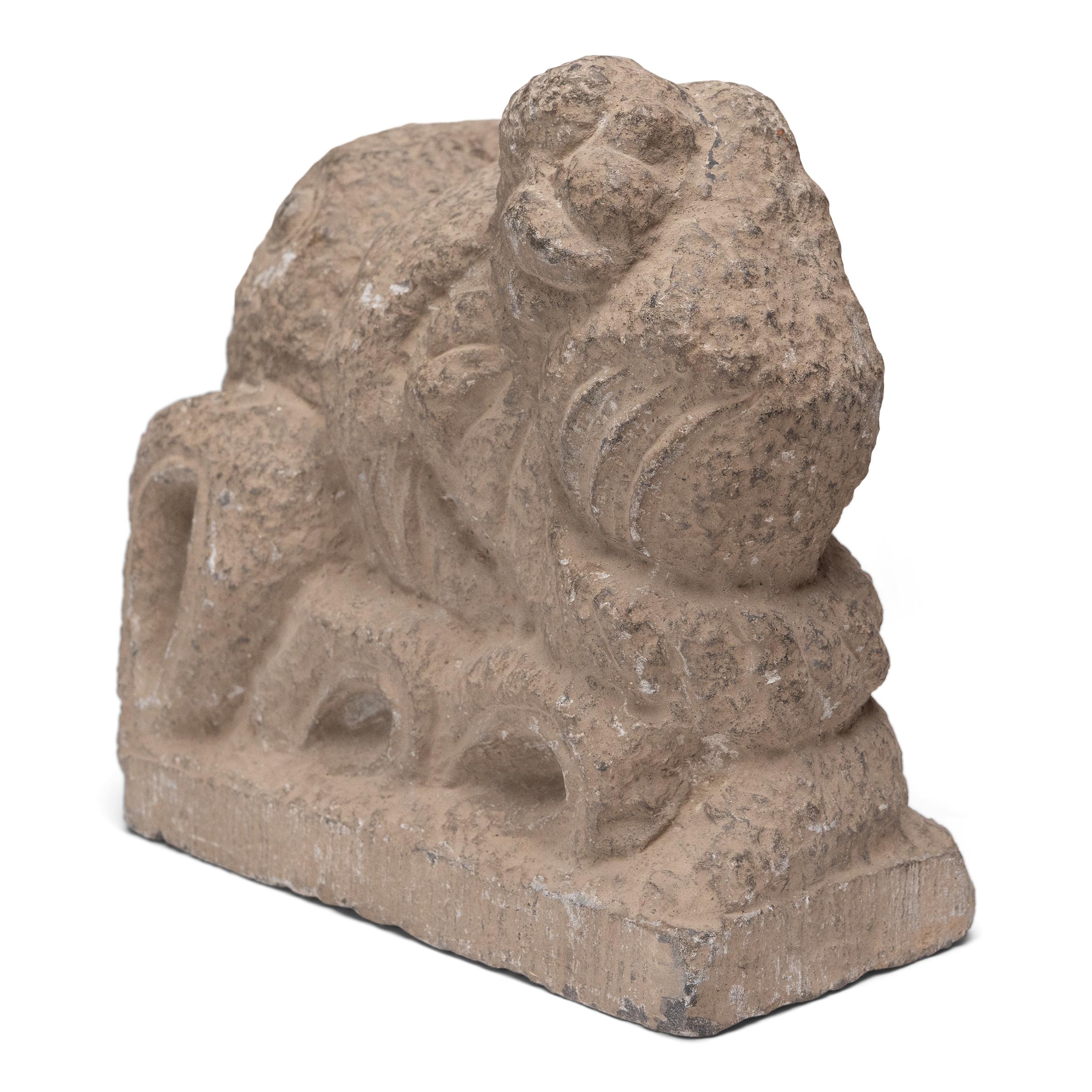 This curious carving dates to the late Qing dynasty (1644-1911), chiseled from solid limestone to an abstract, zoomorphic form. Possibly originating as an architectural finial, the stone sculpture has curving contours and evocative details