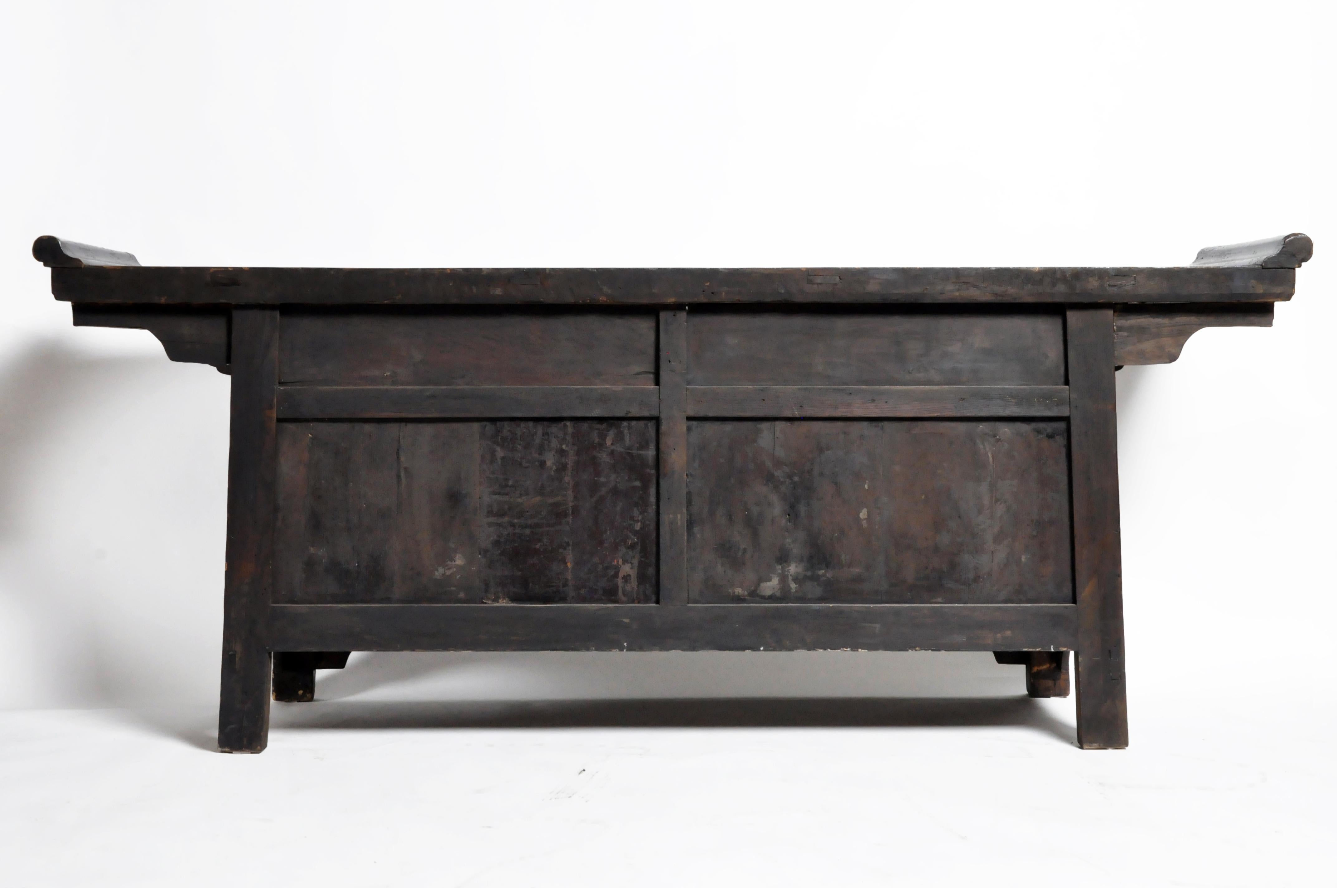This gorgeous altar coffer is from the Shanxi Provence, China and was made from elm wood and oxblood lacquer, circa 1850. The piece features its beautifully aged original patina with three drawers and a pair of doors for storage.