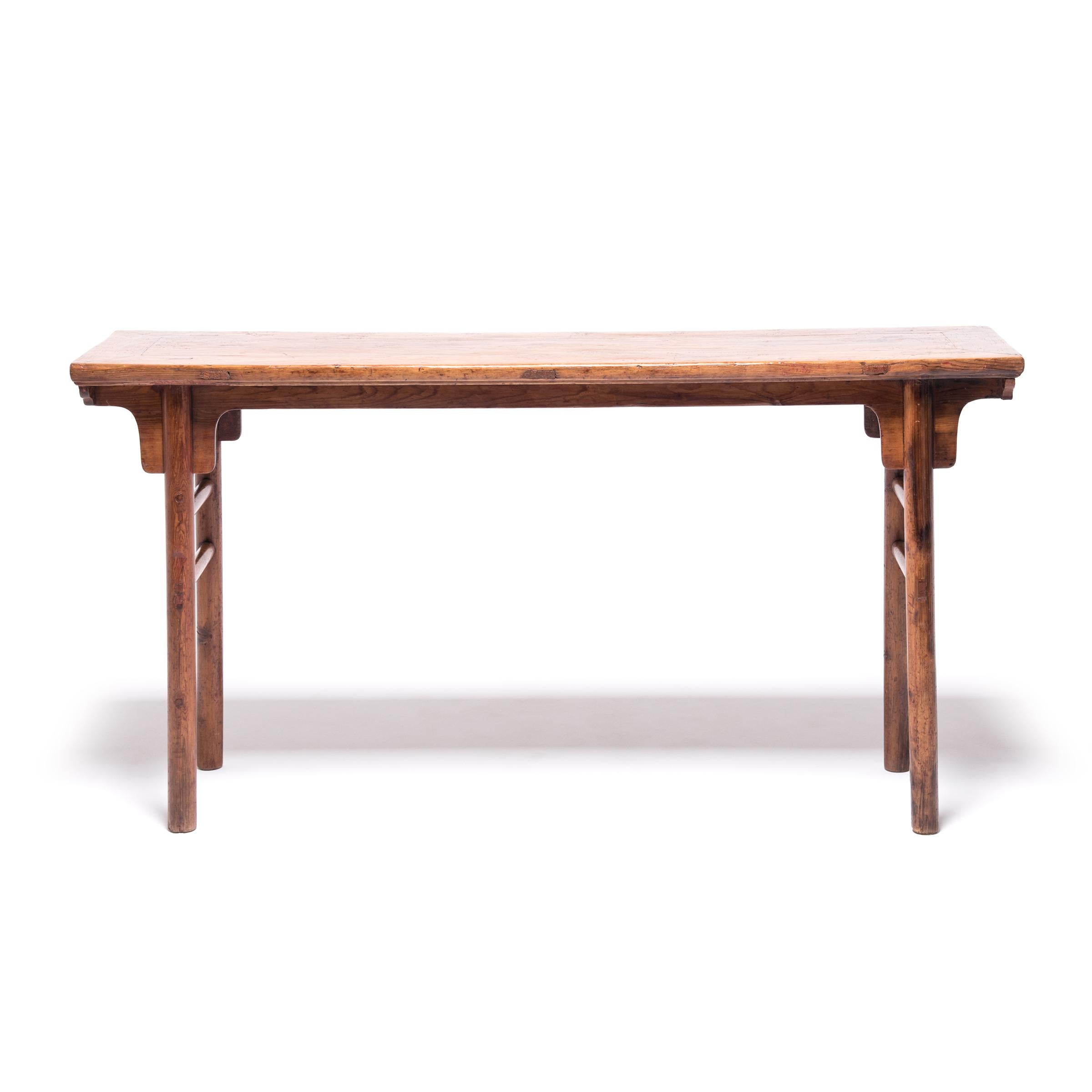 Over 150 years ago this splendid cypress wood table sat as the centerpiece in a family’s home in China's Shanxi province. It probably served as their altar, the place where they paid respects to their revered ancestors. The elegant table is inspired