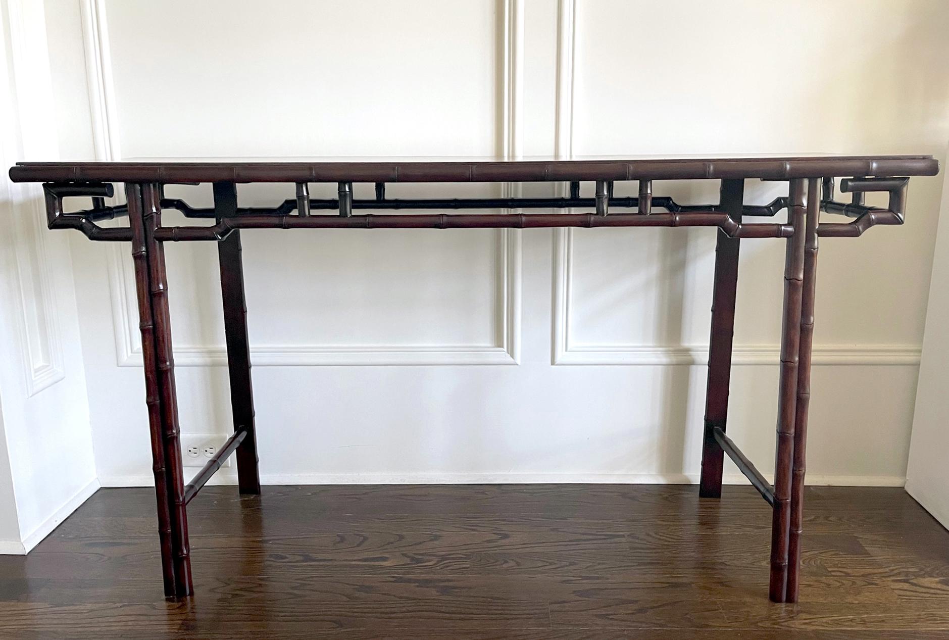 A Chinese wood altar table or console table circa late 19th to early 20th century (late Qing dynasty to the Republic era). The table was constructed with mixed wood types. The legs and fret-apron surround are of a reddish Mohagany type wood