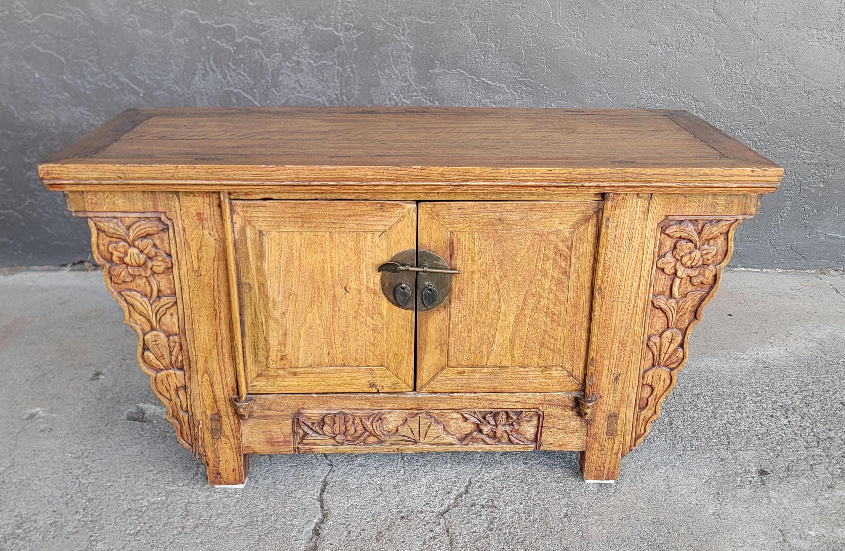 A Chinese alter cabinet in the Qing Dynasty style. 20th Century. 

39.5 inches wide.
21 inches high.
16.5 inches deep.