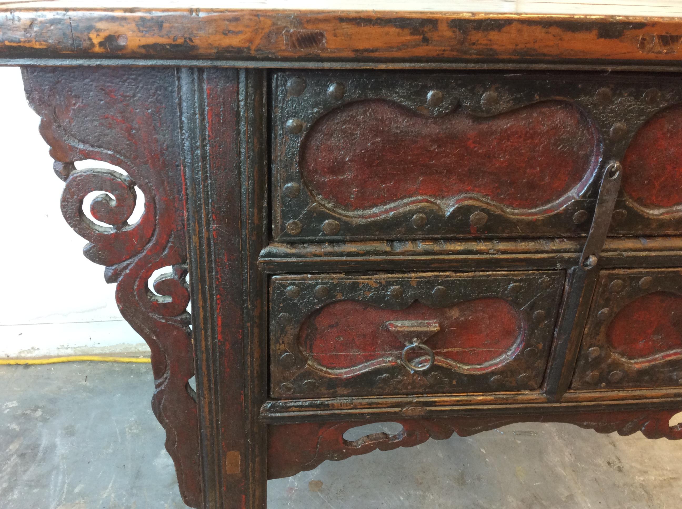 Late 19th / early 20th century three drawer Elm wood Mongolian Altar or butterfly table. This table is late Qing Dynasty and has a great old crazed painted finish and a nice patina to the smoothed over Elm wood top.

Condition: repairs to the