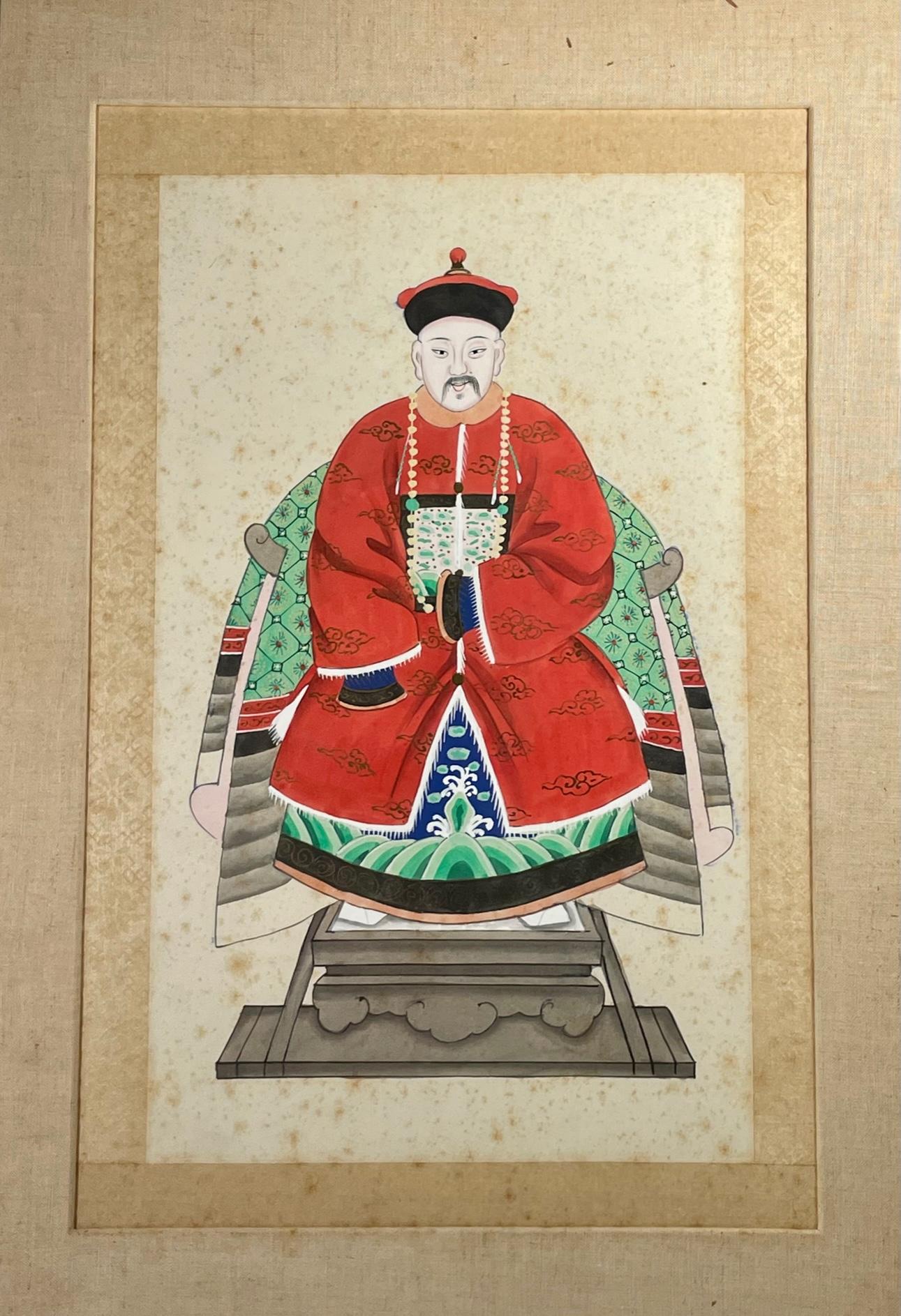 Chinese ancestor portrait of a Mandarin Dignitary. 

Antique tempera on paper painting of a Mandarin Dignitary wearing a red court dress and seated on a throne chair. Based on the style of his formal robe, this man was probably an official of the
