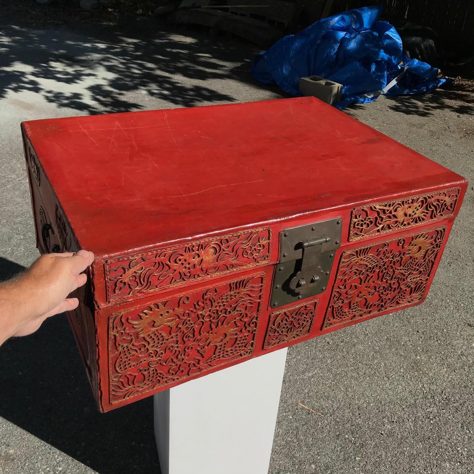 Found during our recent Japanese Acquisition travels.

Unusual Chinese antique red leather storage trunk,Qing dynasty, 19th century.

Complete with original cast iron clasp, gold gilt highlights and in Fine clean condition.

Applied giltwood