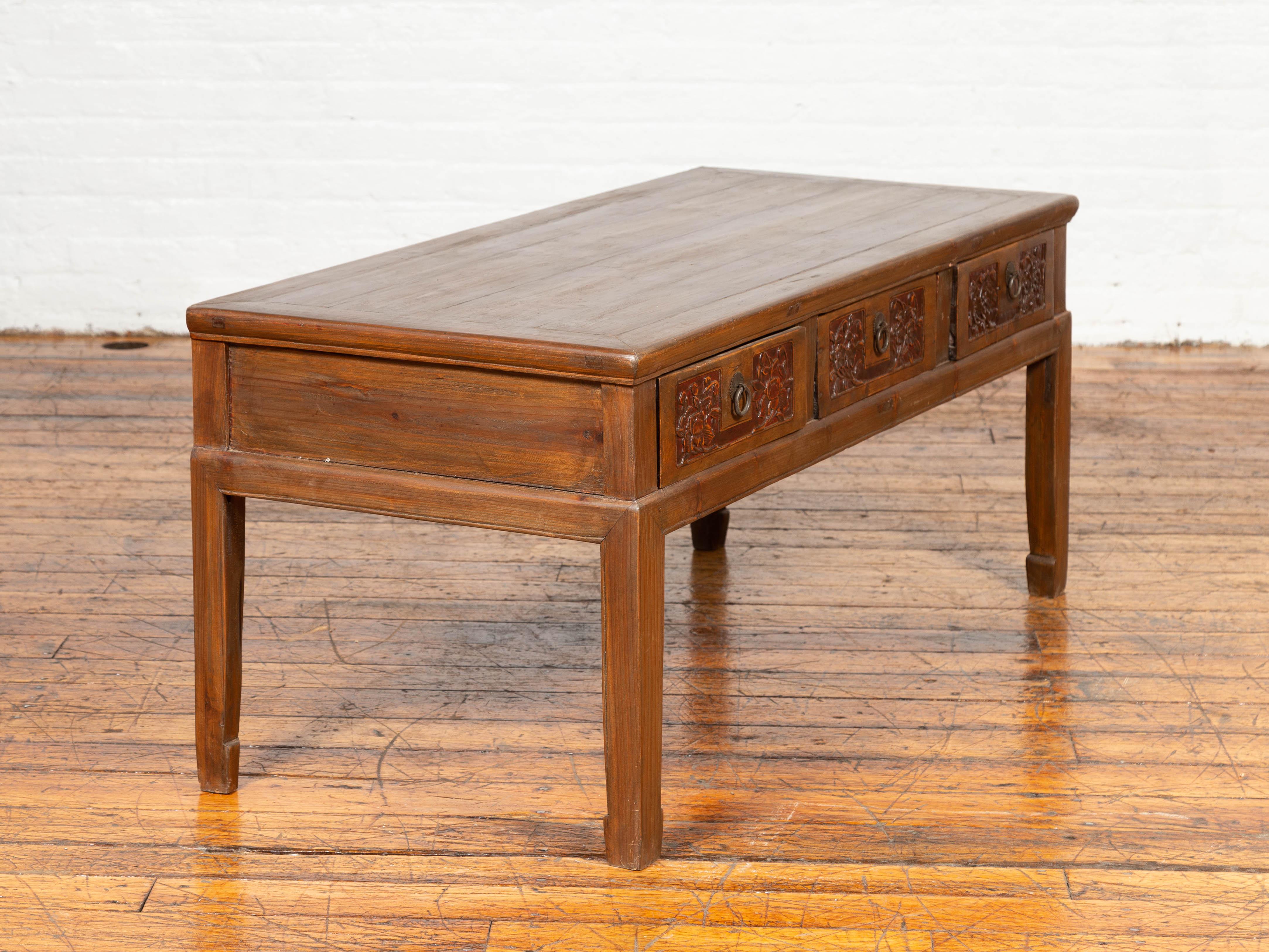 Chinese Antique Elm Coffee Table with Floral Carved Drawers and Horsehoof Legs 2