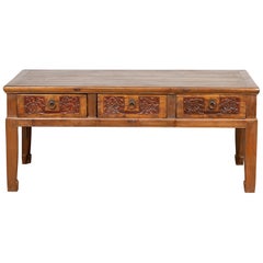 Chinese Antique Elm Coffee Table with Floral Carved Drawers and Horsehoof Legs