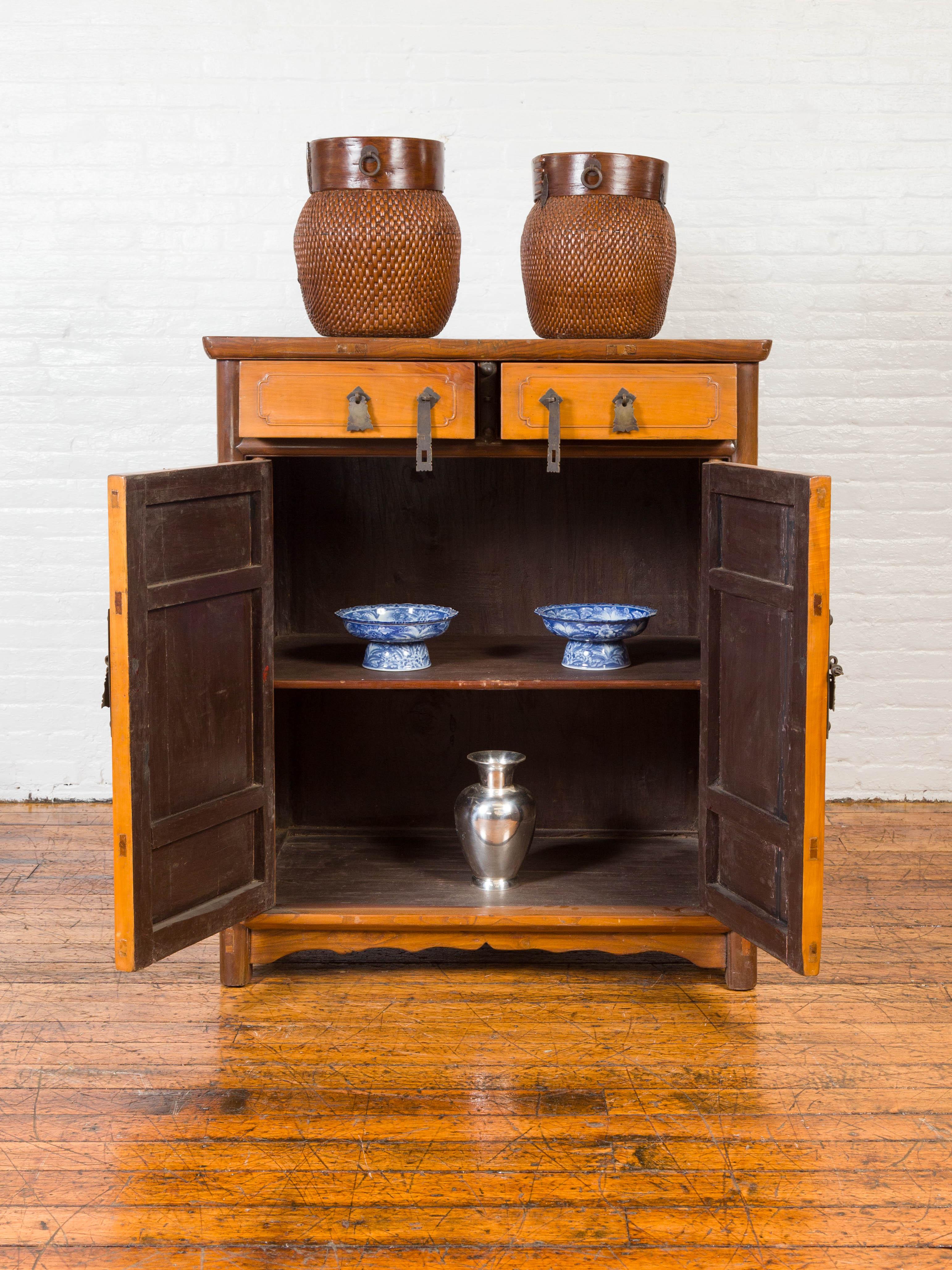 20th Century Chinese Antique Elm Two-Toned Cabinet with Cut Bronze Hardware and Yellow Patina For Sale