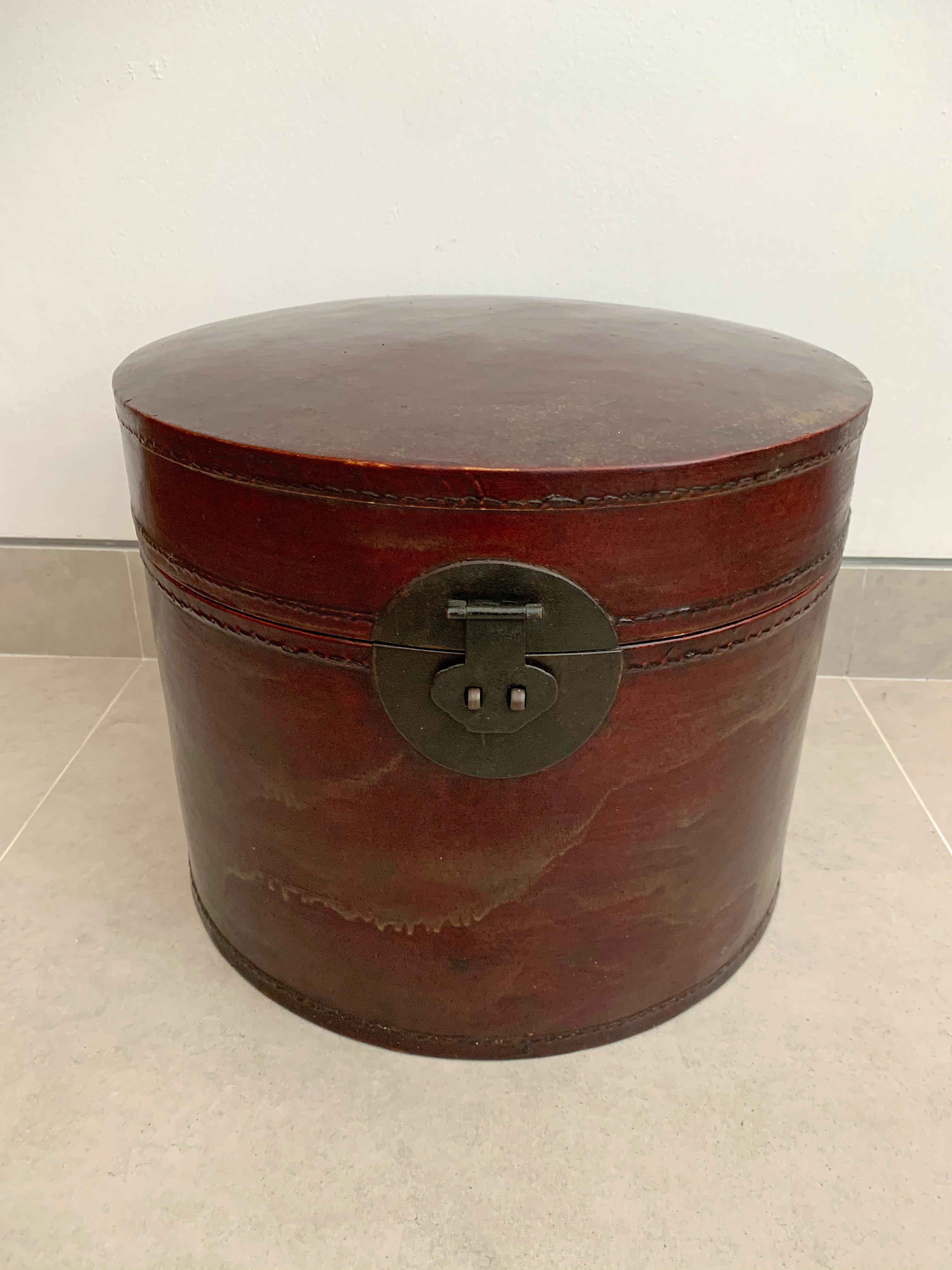 Amid the Qing Dynasty Hats were a form of status symbol, so much so that the boxes to protect and preserve these hats were also elegantly crafted. This late 19th-century hat box is crafted from lacquered leather and once belonged to someone high