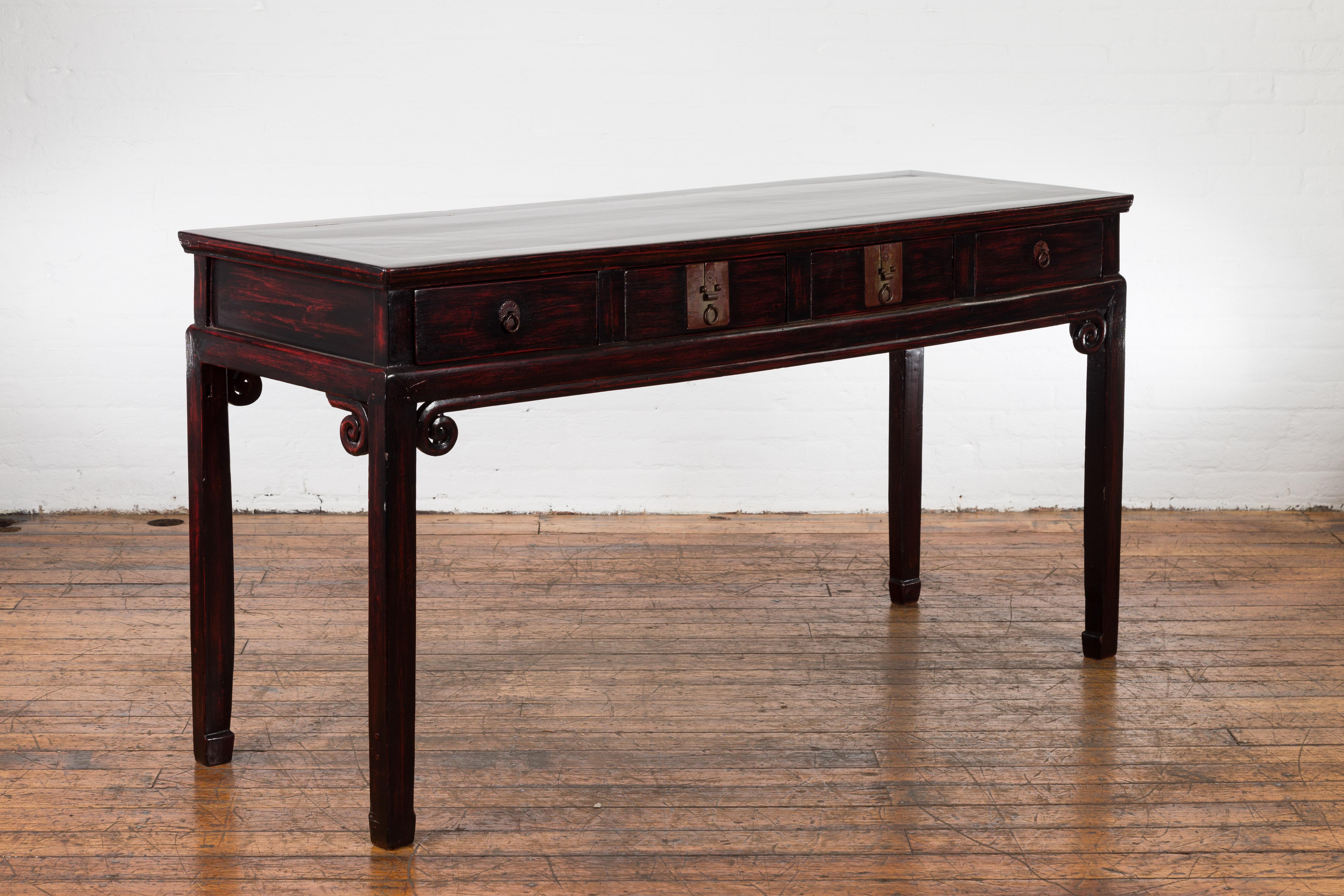 Carved Chinese Antique Lacquered Wooden Desk with Four Drawers and Curling Scrolls For Sale