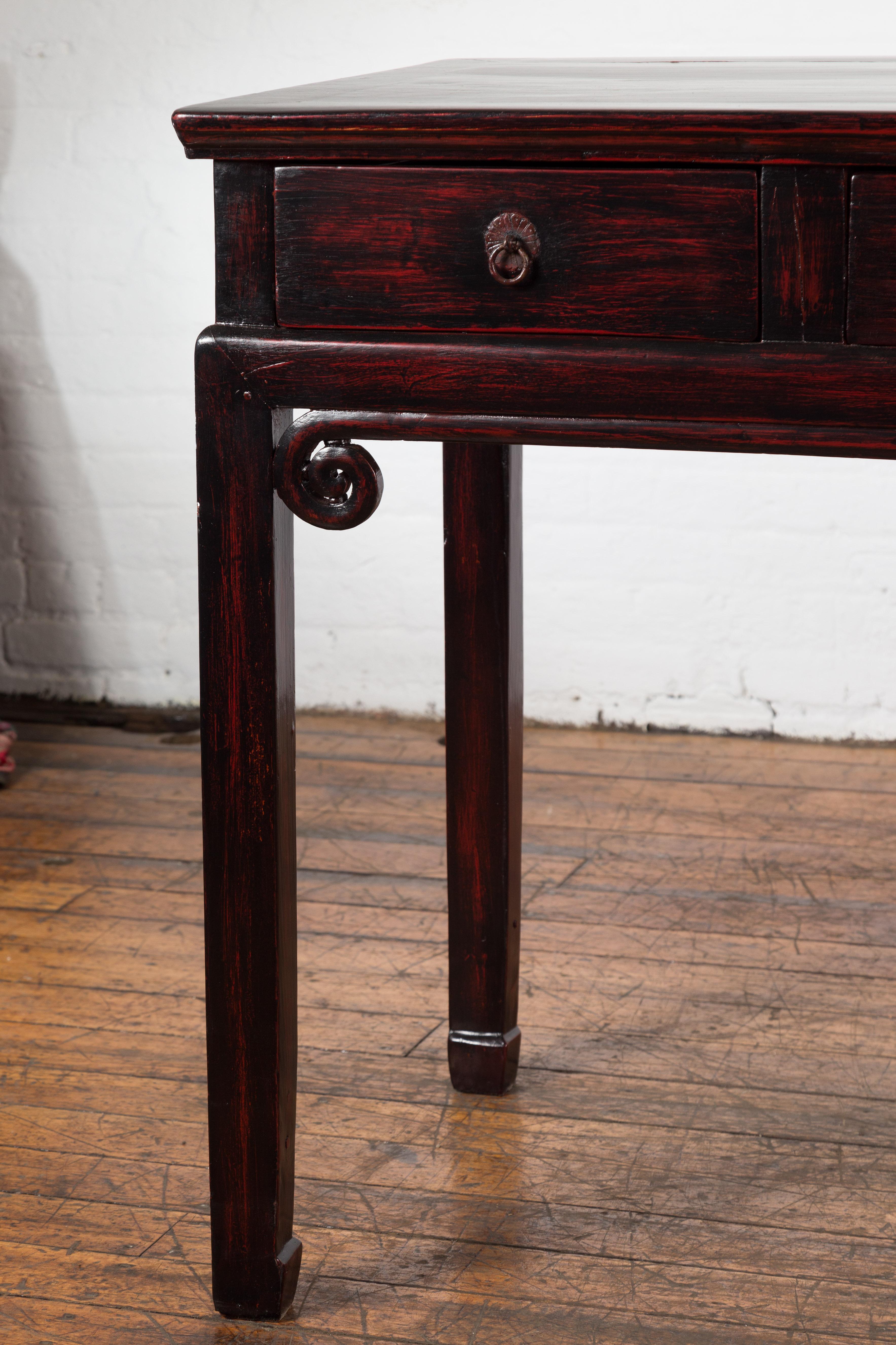 Brass Chinese Antique Lacquered Wooden Desk with Four Drawers and Curling Scrolls For Sale