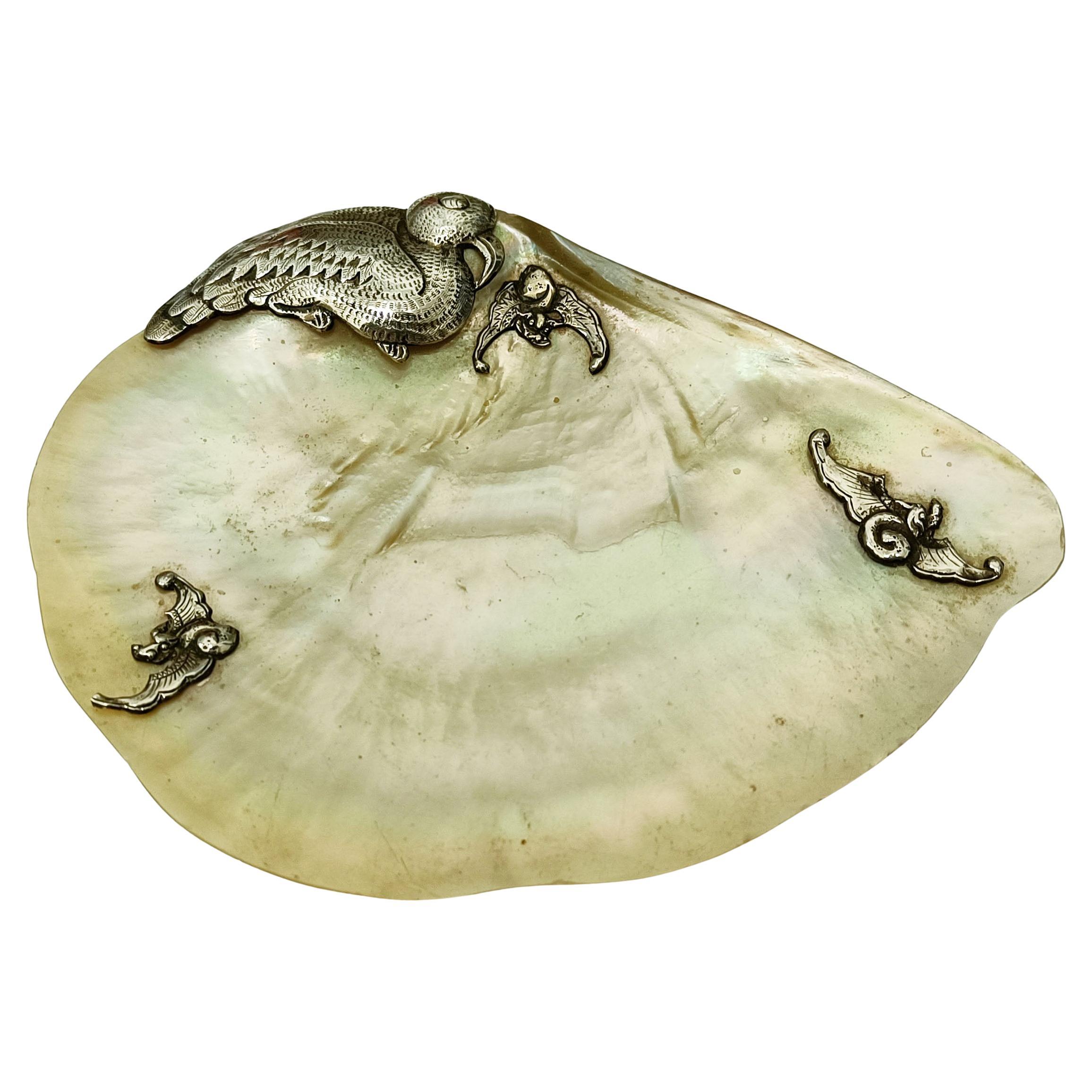 

A  particularly fine Chinese mother of pearl dish with silver bird decoration the underside with silver ball feet
Period Early 20th century
 

 