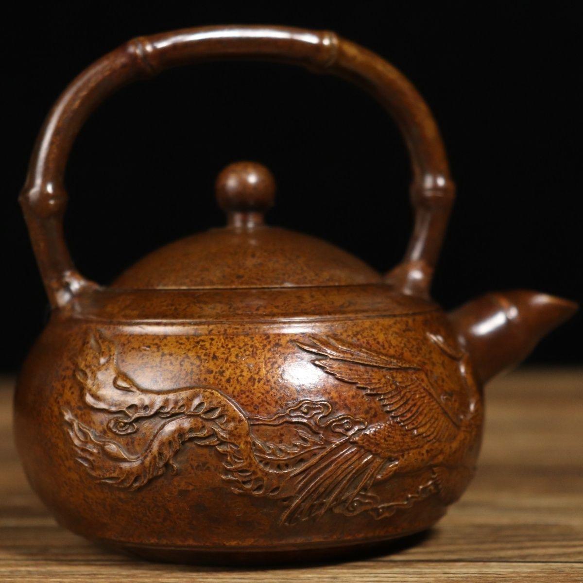 Old collection of this Chinese Bronze Teapot with Dragon and Phoenix, the mark on the bottom Qian Long Nian Zhi means it was made in Qing dynasty Qian Long period, unique style and exquisitely carved, good for decoration and