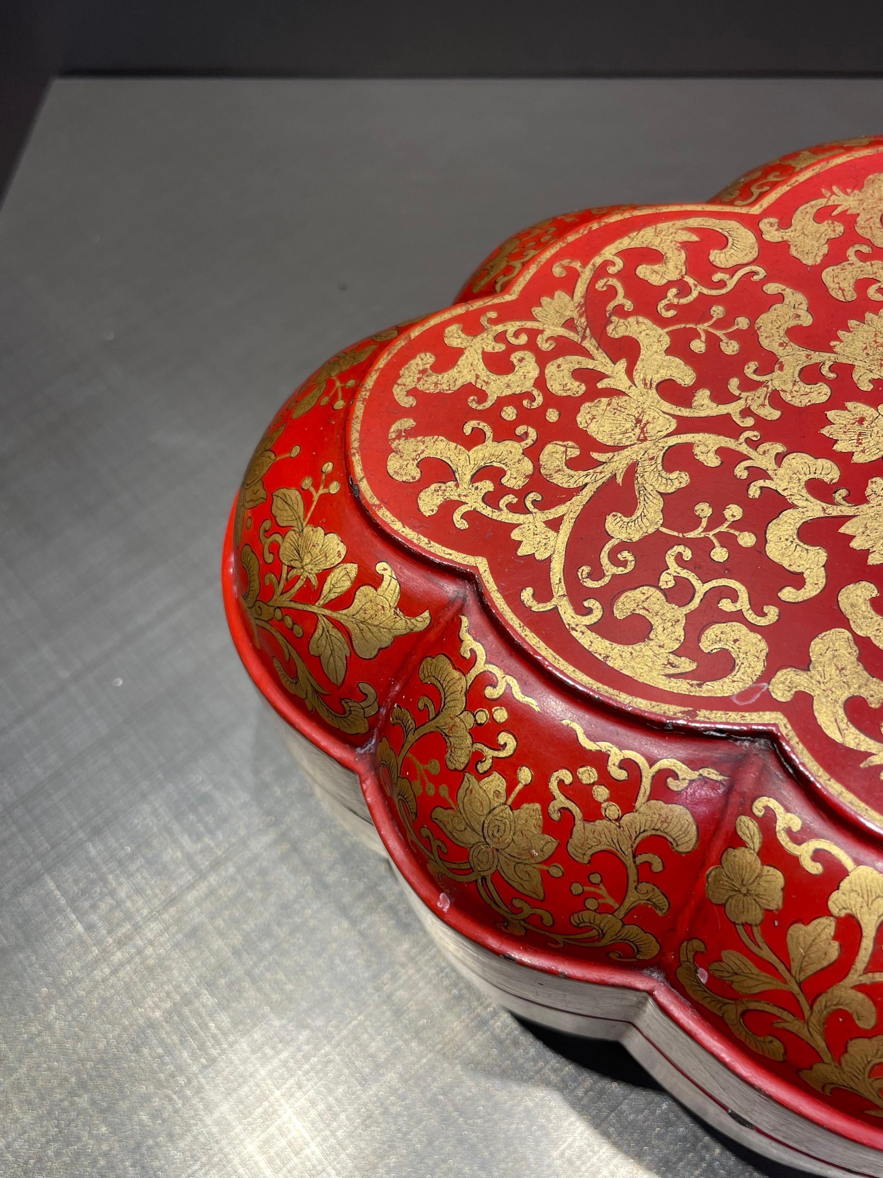 This gorgeous box is beautifully decorated with delicate gold gilt on a bright vermilion base. Signed Qianlong year.