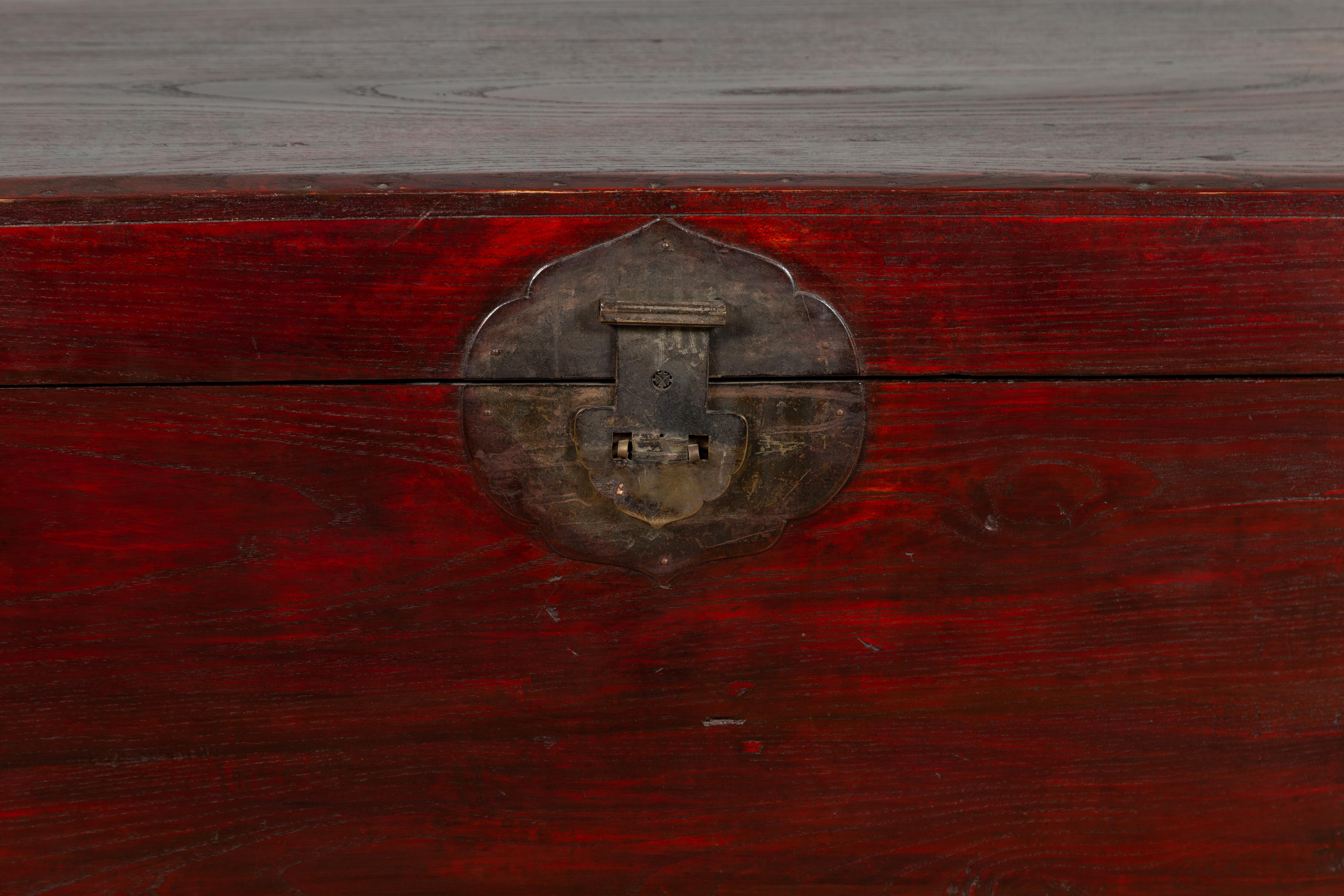 20th Century Chinese Antique Red Lacquered Trunk with Incised and Carved Motifs and Handles