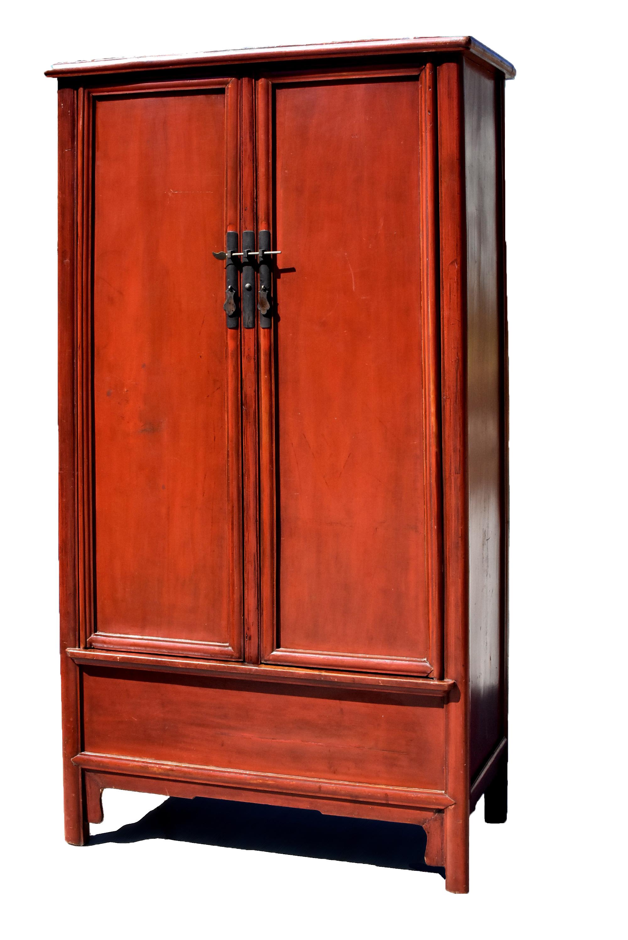 A highly sophisticated, beautiful early 19th century round corner cabinet in russet cinnabar. A miter, tenon and mortise construction creates the top which four round, vertical posts at each corner tenon through. Same construction repeats on the