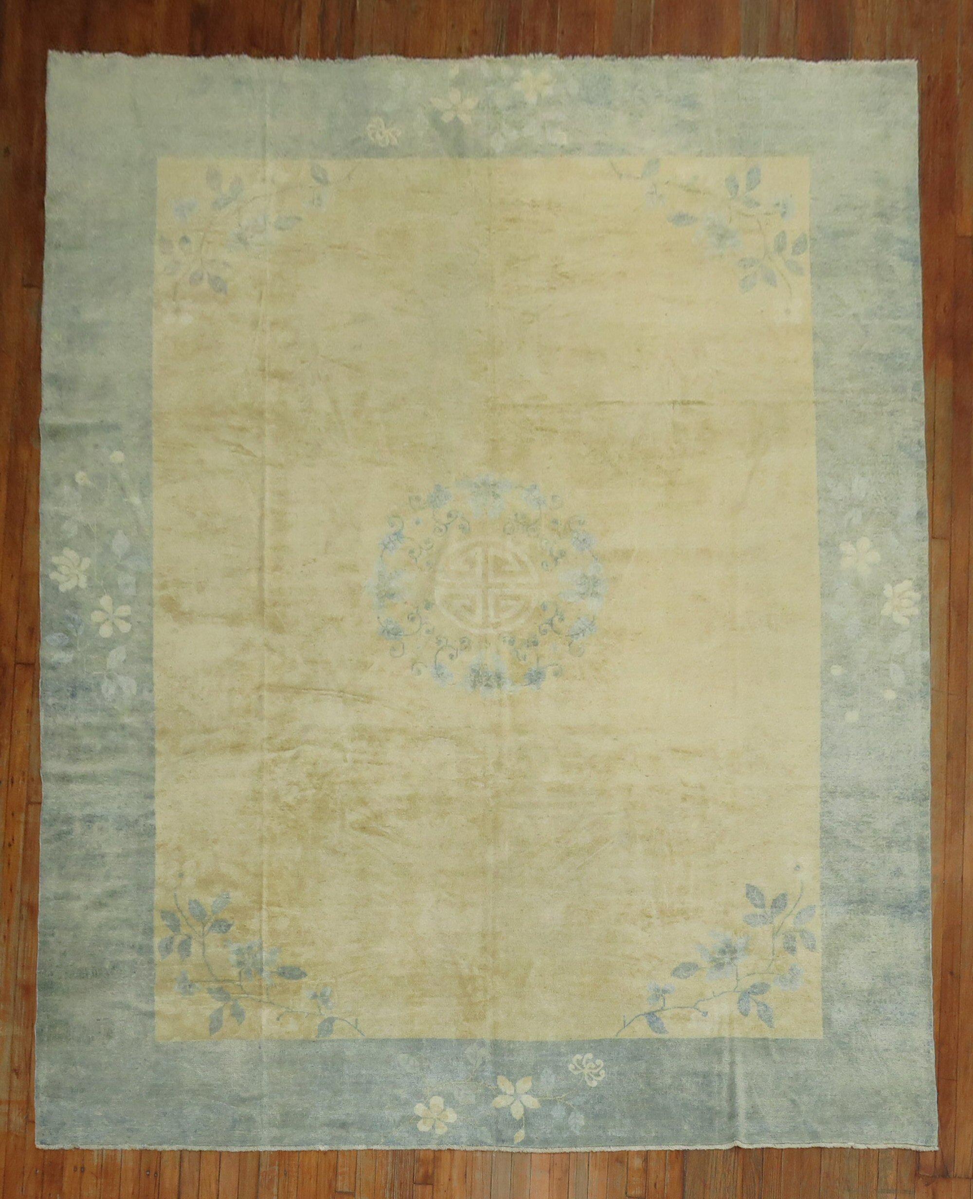 An early-20th-century room size Chinese rug in beige and light blue. The wool and feel of the rug is very soft on the feet. 

Measures: 9'' x 11'6''.