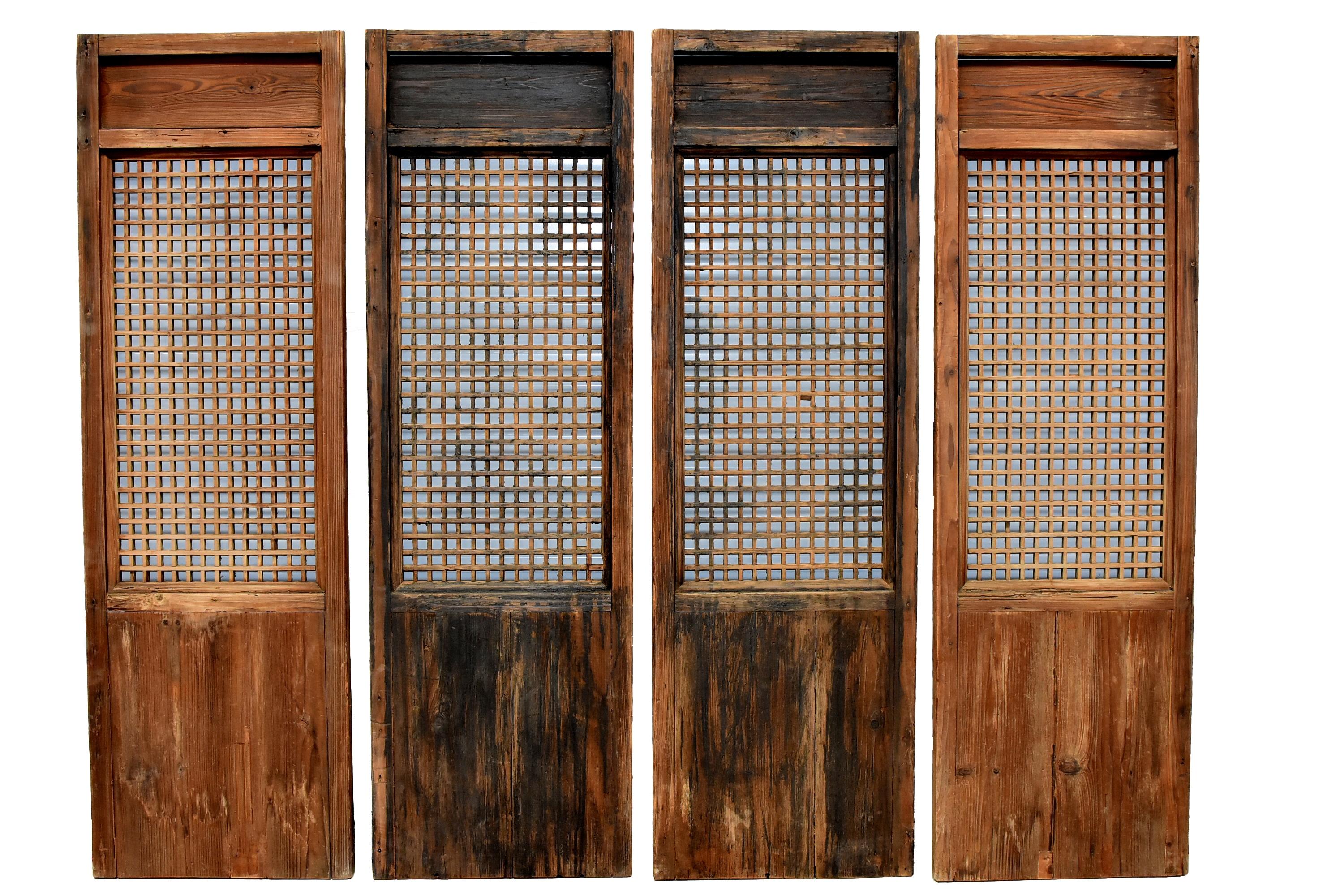 This is a set of beautiful, all original, rare, 19th-early 20th century Ming style Chinese antique window screens. The simple, elegant design is timeless. The main section of the screen is formed by a small cube design, which are created by joining