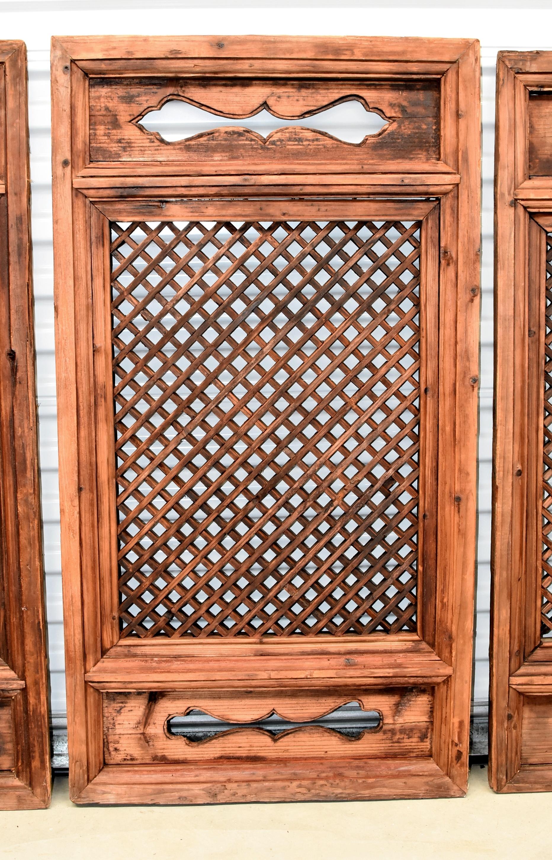 Set of five 19th century Ming style Chinese antique window screens featuring stylized, hand-carved ruyi and small cube design. The cubes are formed by joining custom cut pieces of wood using tenons and mortises, an incredibly painstaking process.