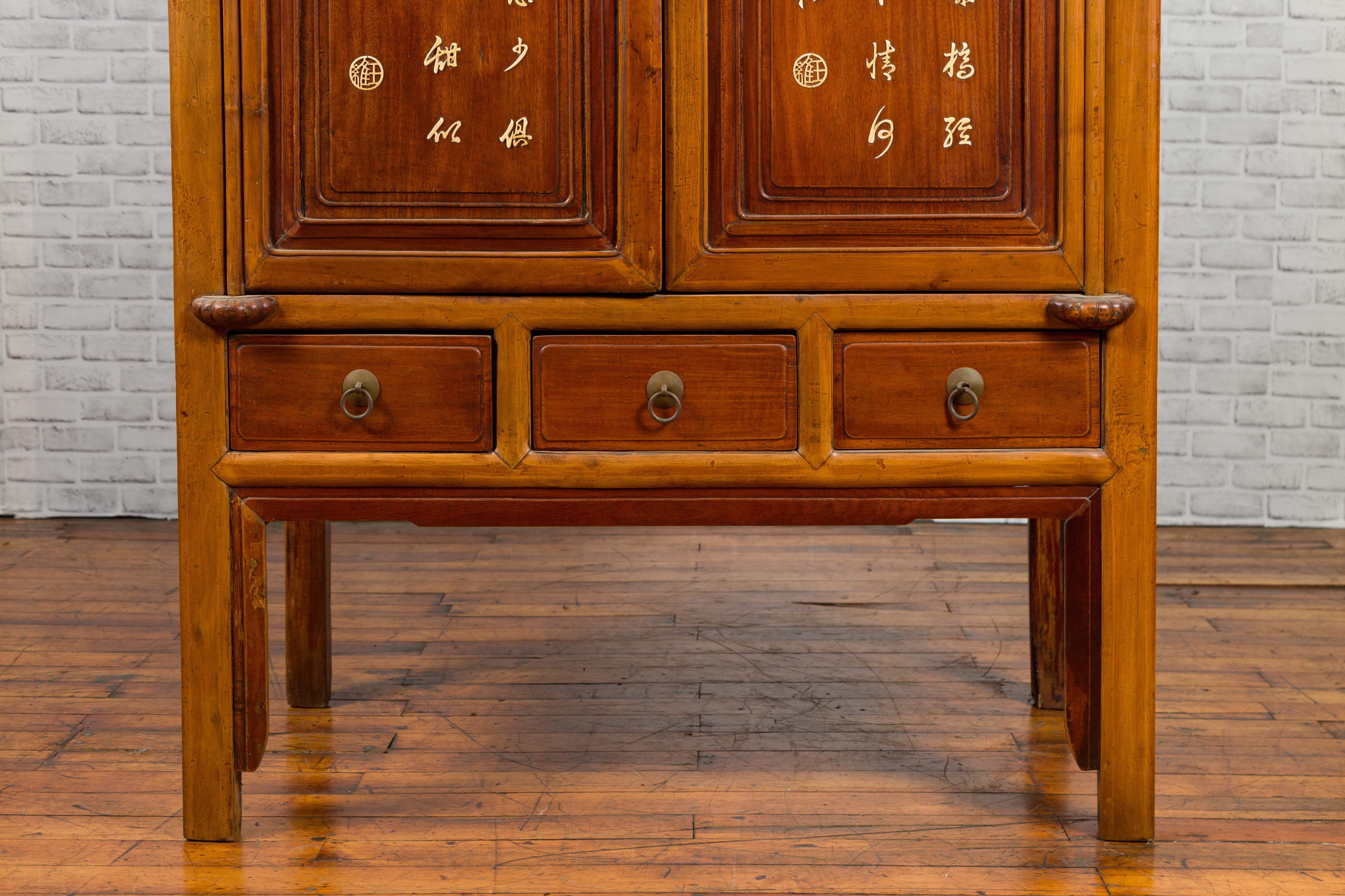 20th Century Chinese Antique Two-Toned Cabinet with Inlaid Calligraphy Motifs and Drawers For Sale