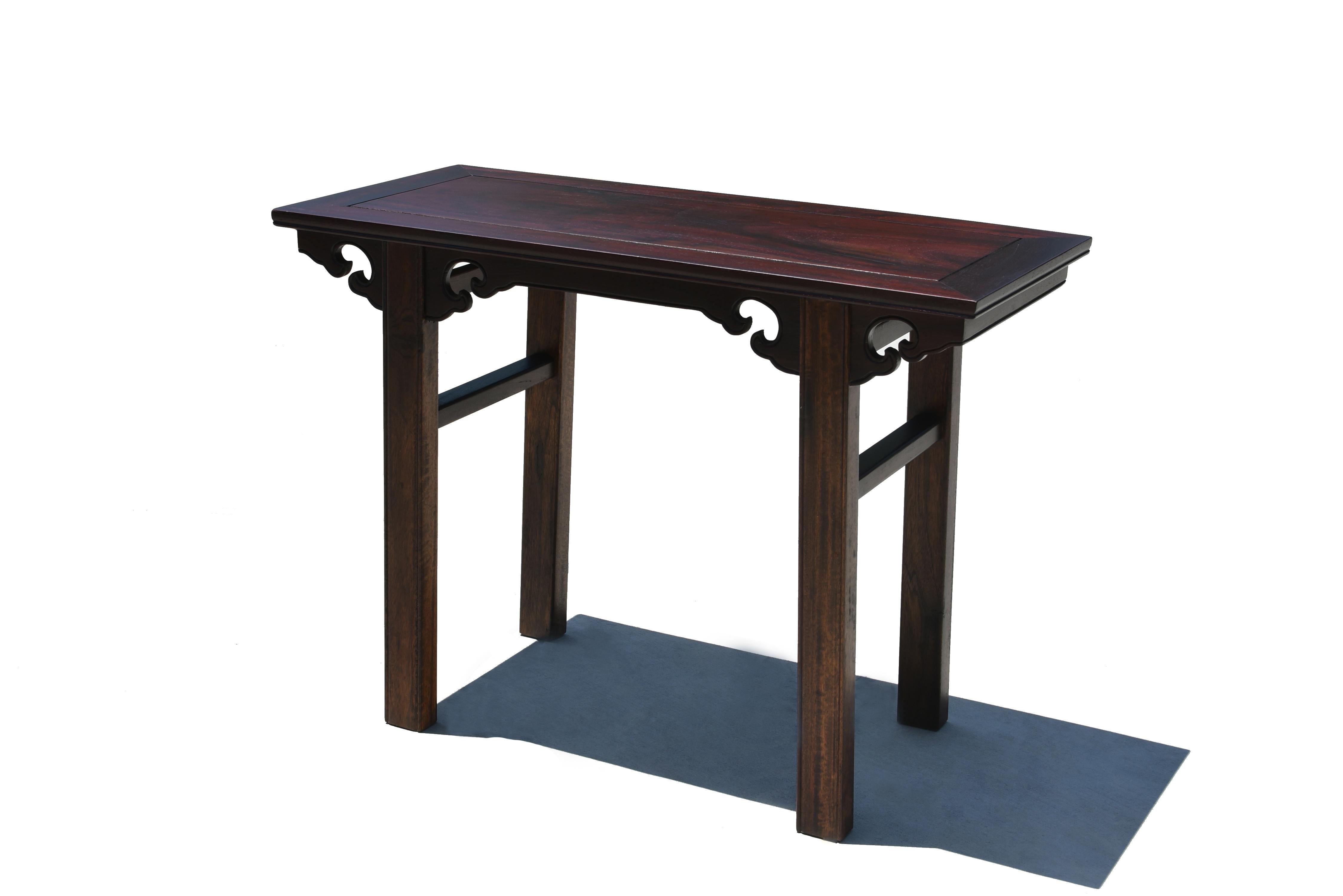 A beautiful late 19th century wine table from Northern China. The tabletop is constructed of four members joined by mitered tenons surrounding a floating panel made of a prized, solid single board of red elmwood. Such an ingenuine design allows the