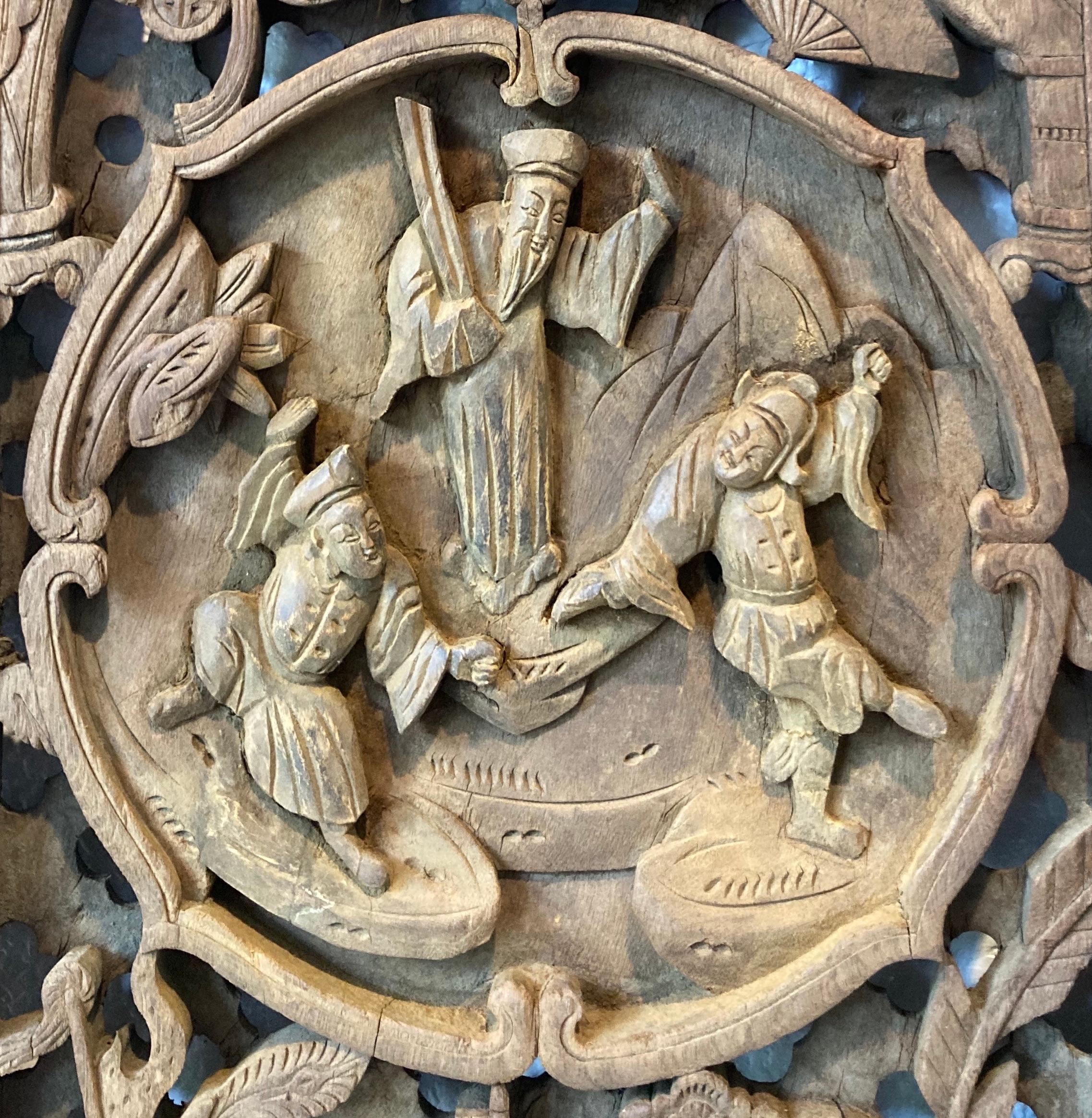 Unframed panel with openwork carving. Carved from one piece of solid wood. Circular center carving with personage, dragon and floral motifs.