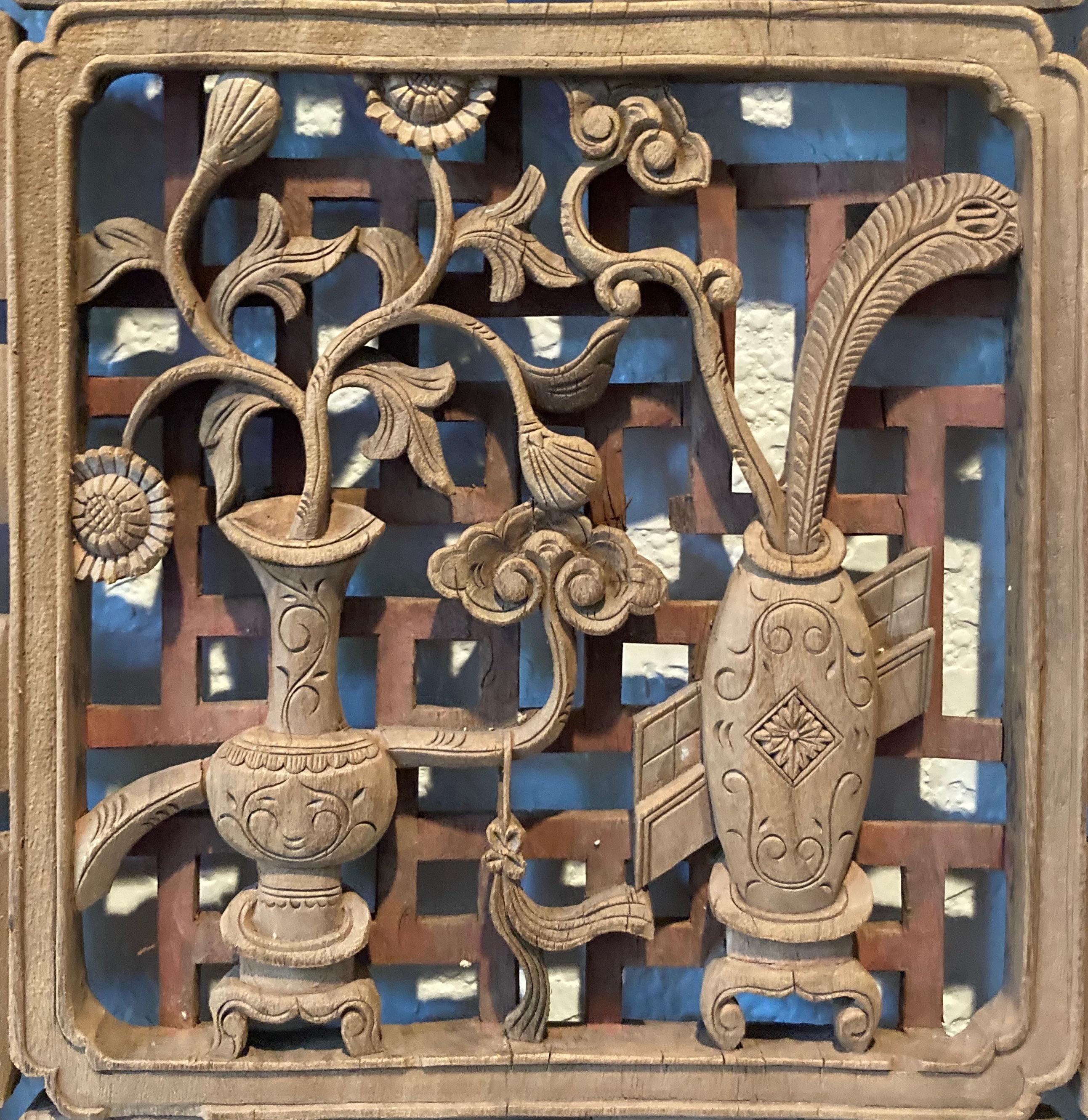 Unframed panel with openwork carving. Carved from one piece of solid wood. Square center carving with vase/floral, and surrounding floral and dragon motifs.