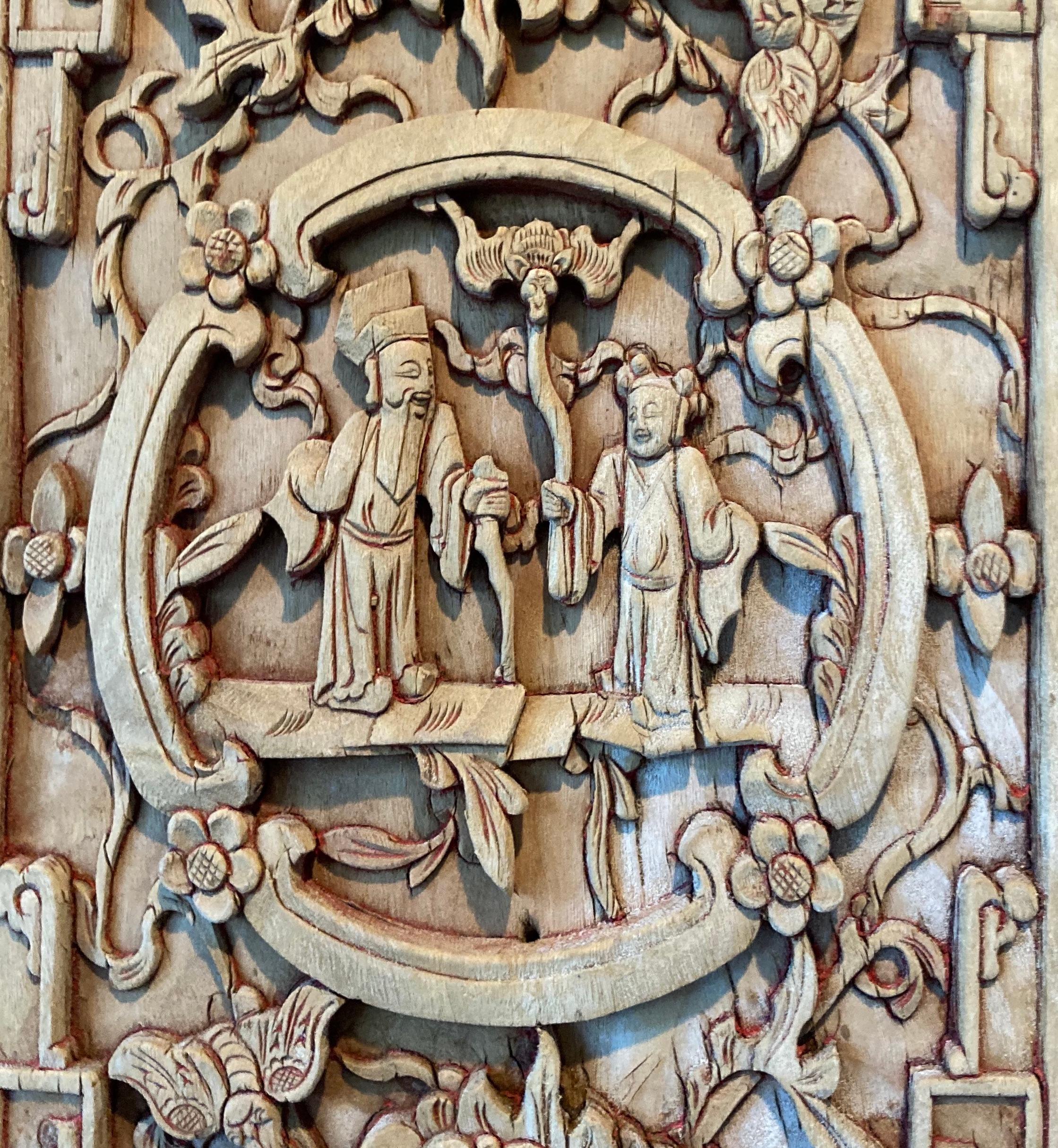 Framed panel with mitered mortise and tenon joints. Panels include four panes, mostly with relief carvings. Panes include circular carvings with personage, beast and floral motifs.