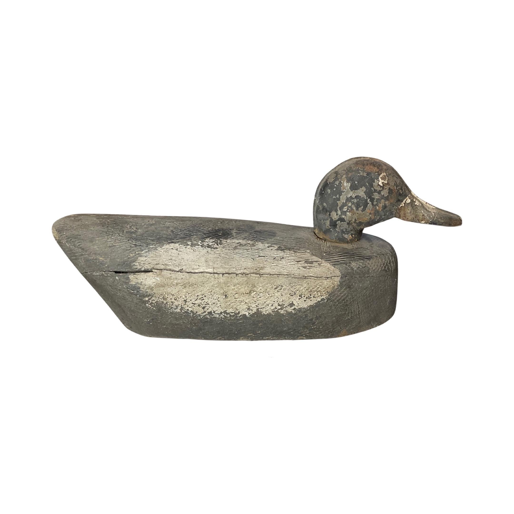 Experience the beauty and craftsmanship of a 19th century Chinese Antique Wooden Duck Decoy Sculpture. Hand-carved from wood, this intricate decoy is a true testament to the artistry of its time. Add a touch of history and elegance to your home