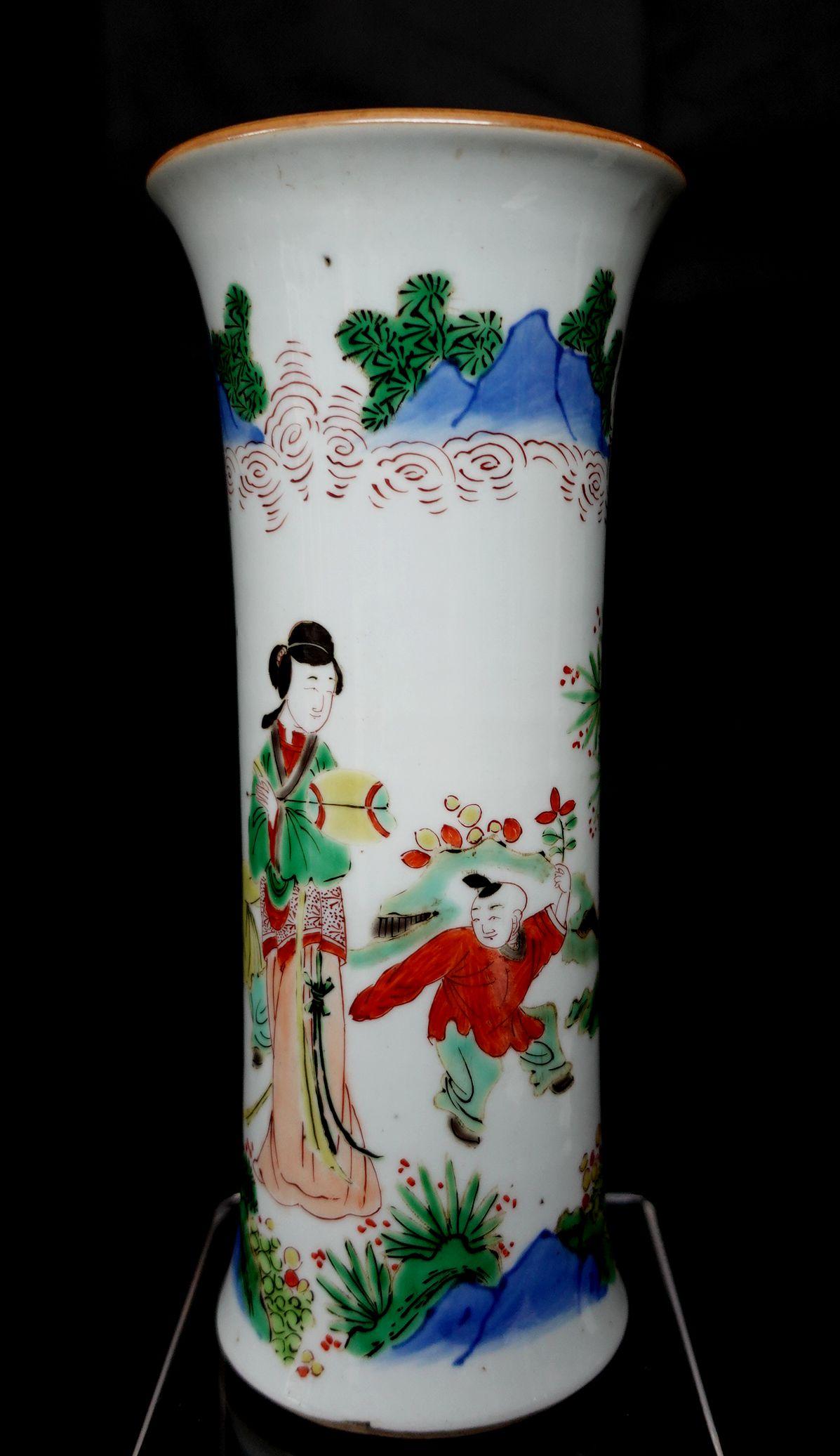 Porcelain vase. China. 19th century. Beaker form. Wu tsai decoration of woman and children. 8.5in high.
 