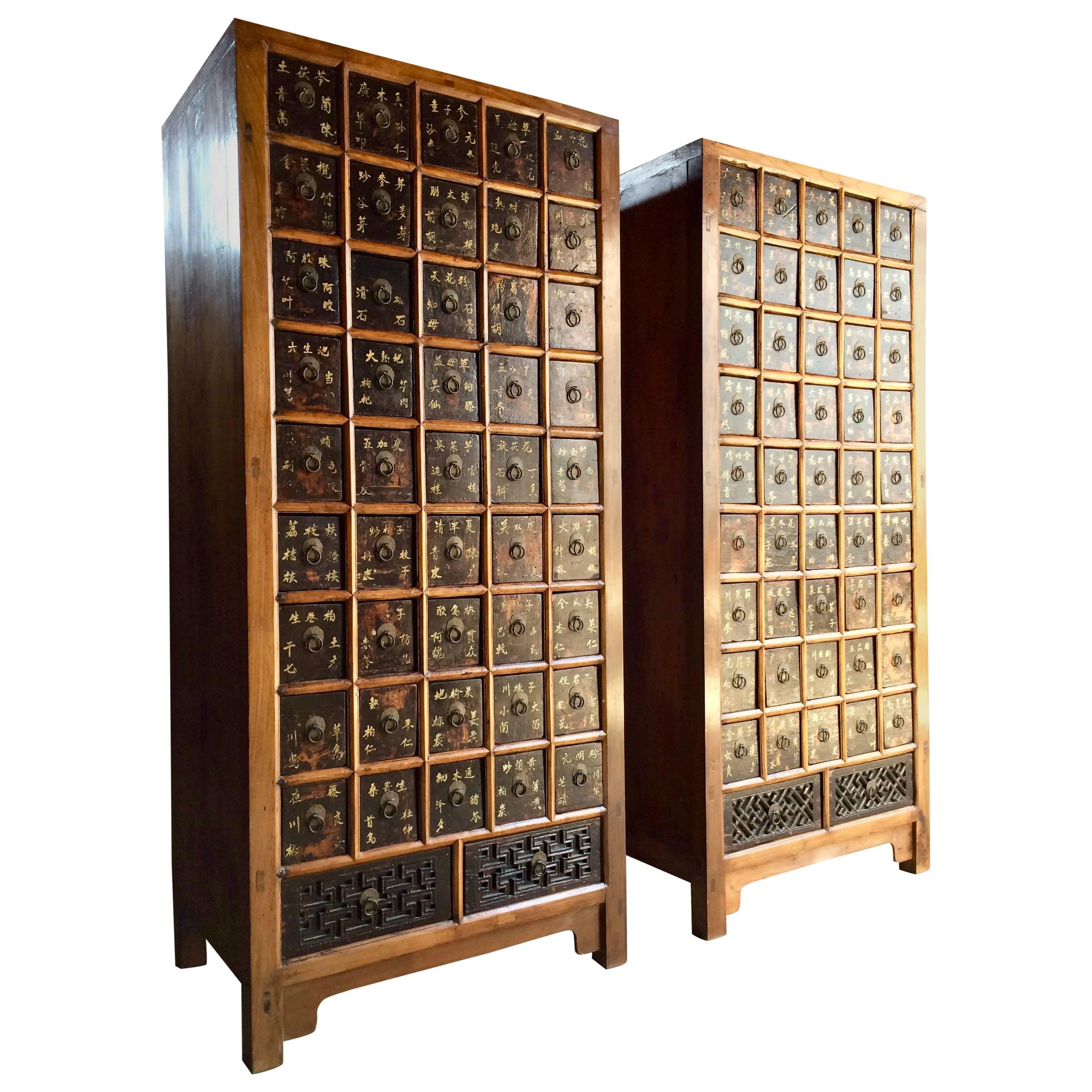 A stunning pair of antique middle Qing dynasty elm apothecary medicine chests dating to circa 1871 from the Shandong province, Northern China, each chest having nine rows of five square drawers (forty five drawers per chest, ninety in total) with