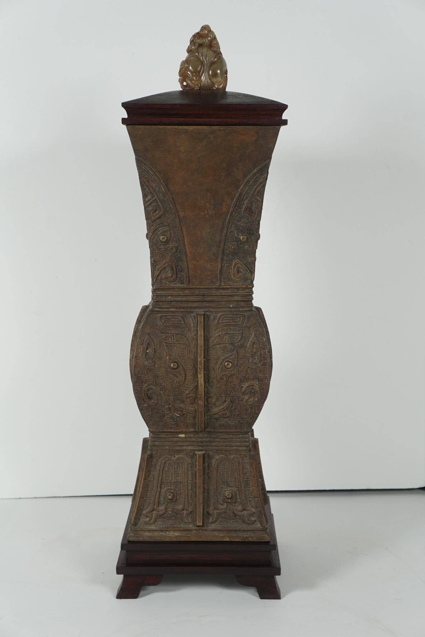 This very finely cast bronze urn in an archaistic form was made in the very late 19th century approximately 1895-1900. Done with an apocryphal feeling to honor the ancient past, the vase is beautifully rendered in low relief in bronze covering