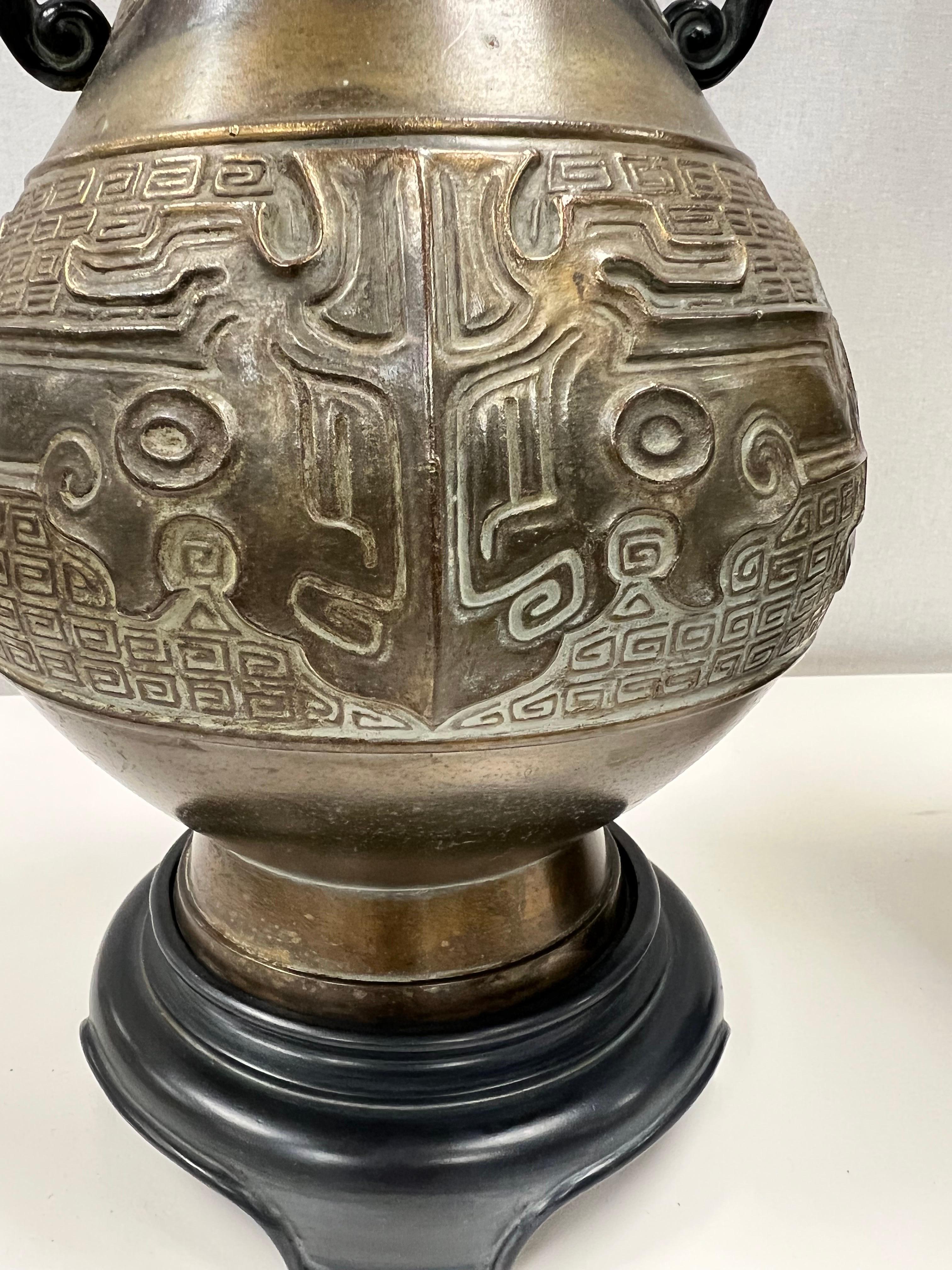 20th Century Chinese Brass Urn Table Lamps With Elephant Handles For Sale