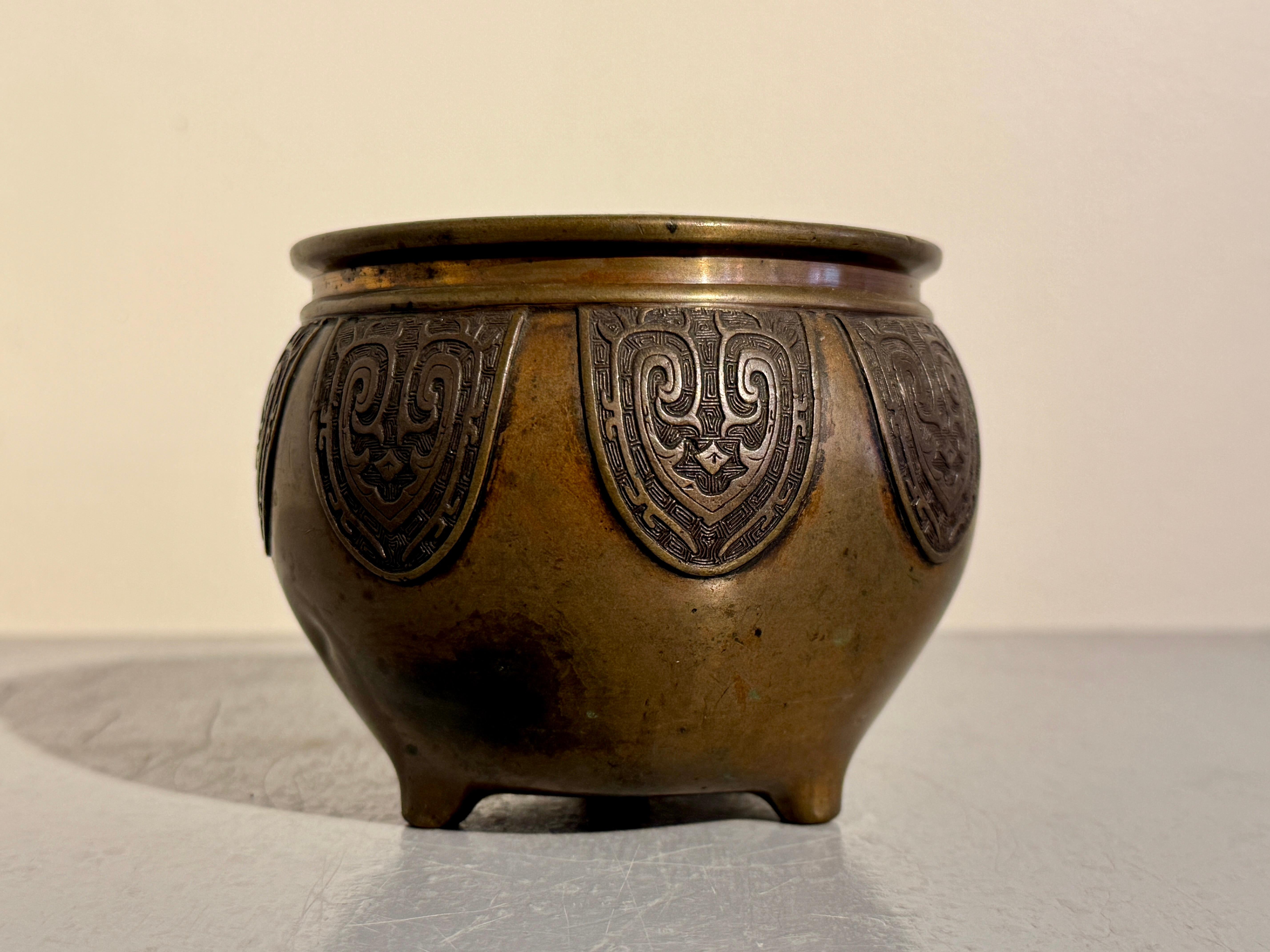 Early 20th Century Chinese Archaistic Bronze Tripod Censer, late Qing Dynasty, c 1900, China For Sale