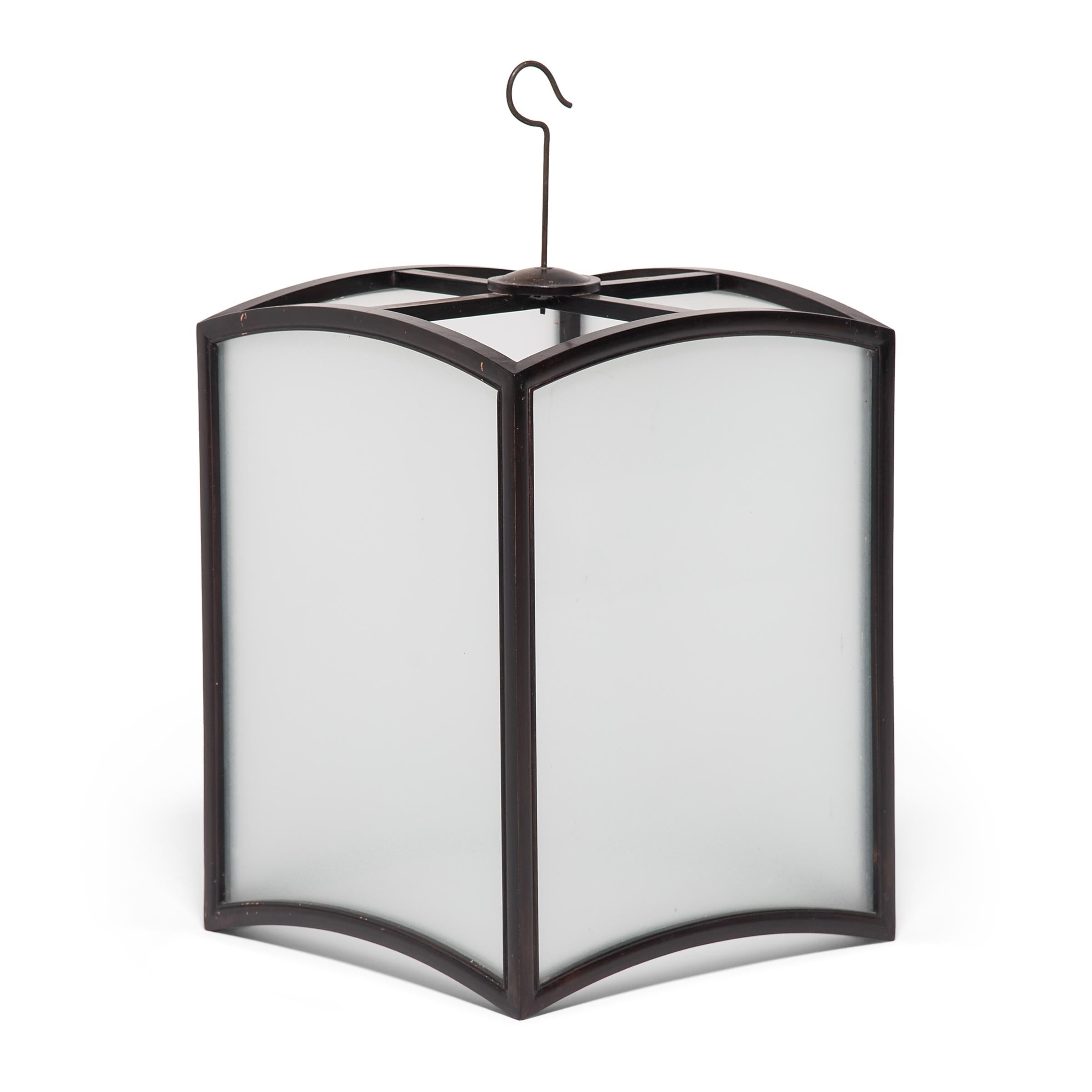 Framed in northern elmwood, this elegant lantern casts a soft glow through frosted glass. Exemplifying the refined simplicity of 19th century Chinese decor, the lantern's clean lines and graceful form make it a versatile lighting option for modern