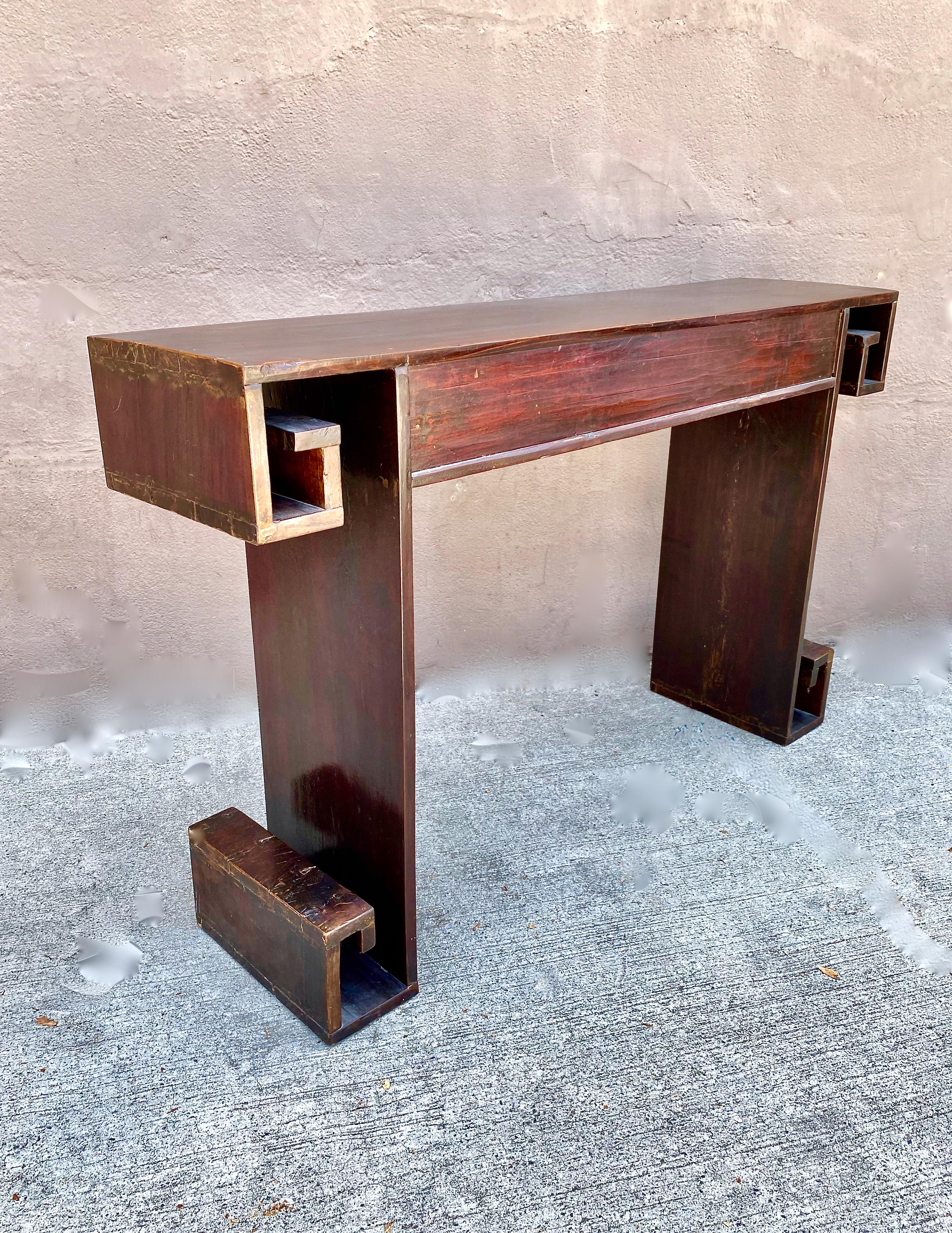 This is a very unusual and attractive early 20th century Chinese altar table. The form is heavily influenced by Art Deco which is revealed in the greek key and meander elements. The table is in overall very good condition--it is currently being
