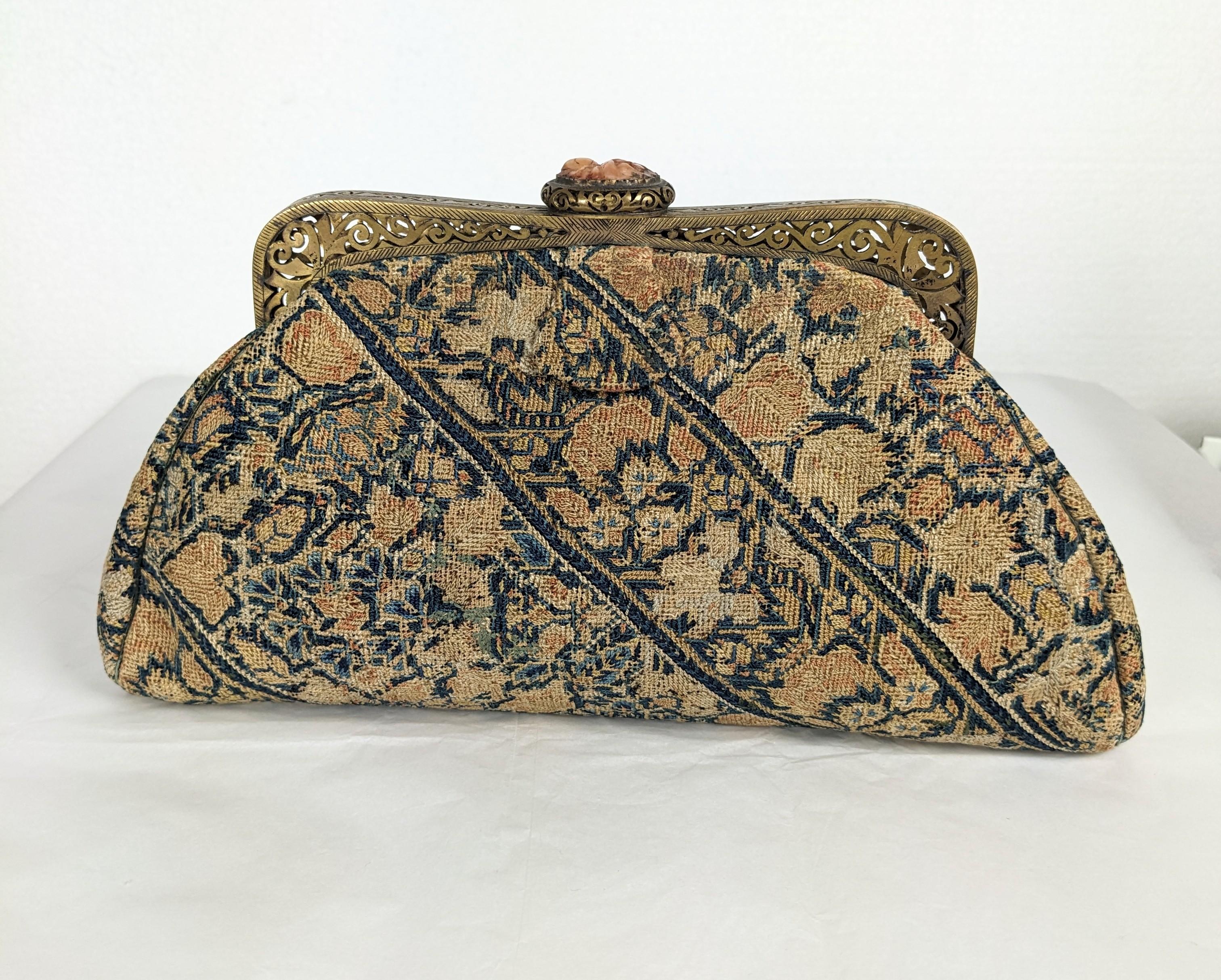 Chinese Art Deco Tapestry Clutch from the 1930's. Likely made in China for the Western market with antique textile mounted on a hand made brass open work frame with carved carnelian finial. 1920's China. 