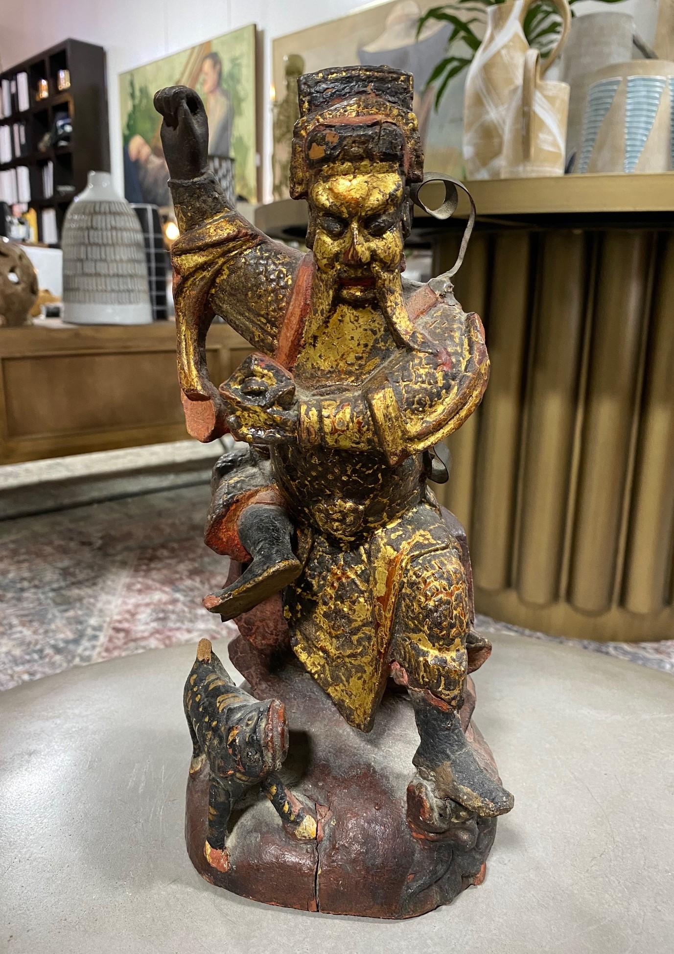 A fantastic wood and gilt decorated hand carved Chinese ancestral temple shrine Emperor figure with a tiger.

From a collection of Chinese and Asian artifacts. 

We are listing it as 19th century but could be earlier. 

Dimensions: 12