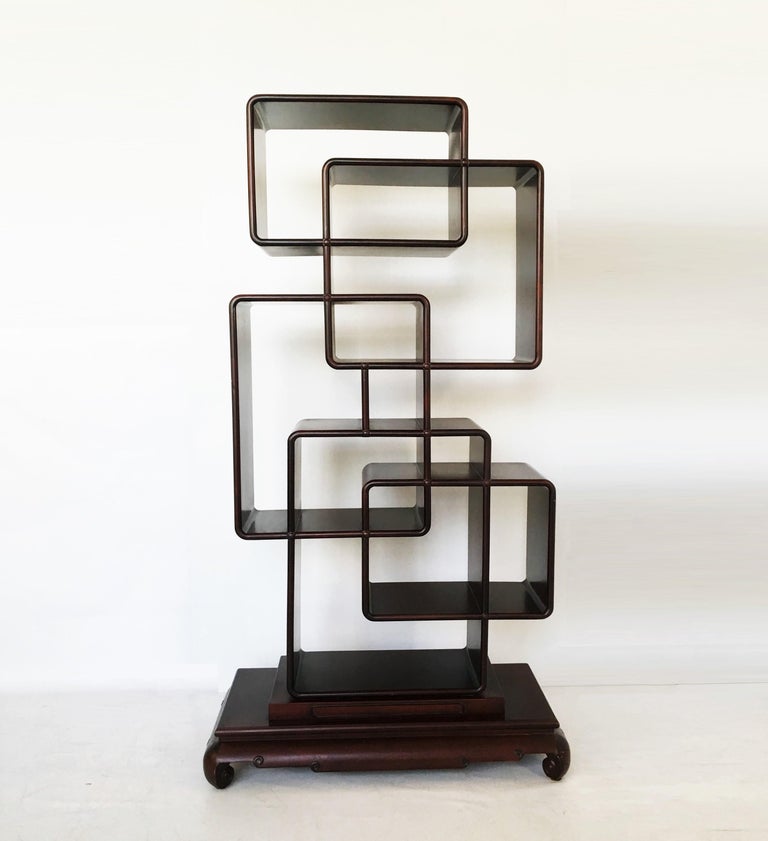 Unique blending of classical Chinese and Art Deco Étagère/ room divider, first quarter of the 20th century. All handcrafted free standing shelving unit, featuring asymmetrically configured shelves for collection display. Scrolled feet and a carved